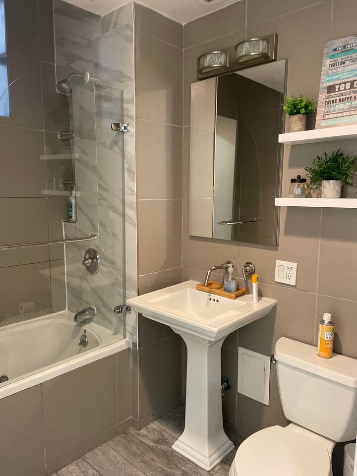 43-45 East 30th Street, Unit 8D Manhattan, NY 10016 - Photo 9 of 11 a bathroom with a sink mirror toilet and bathtub