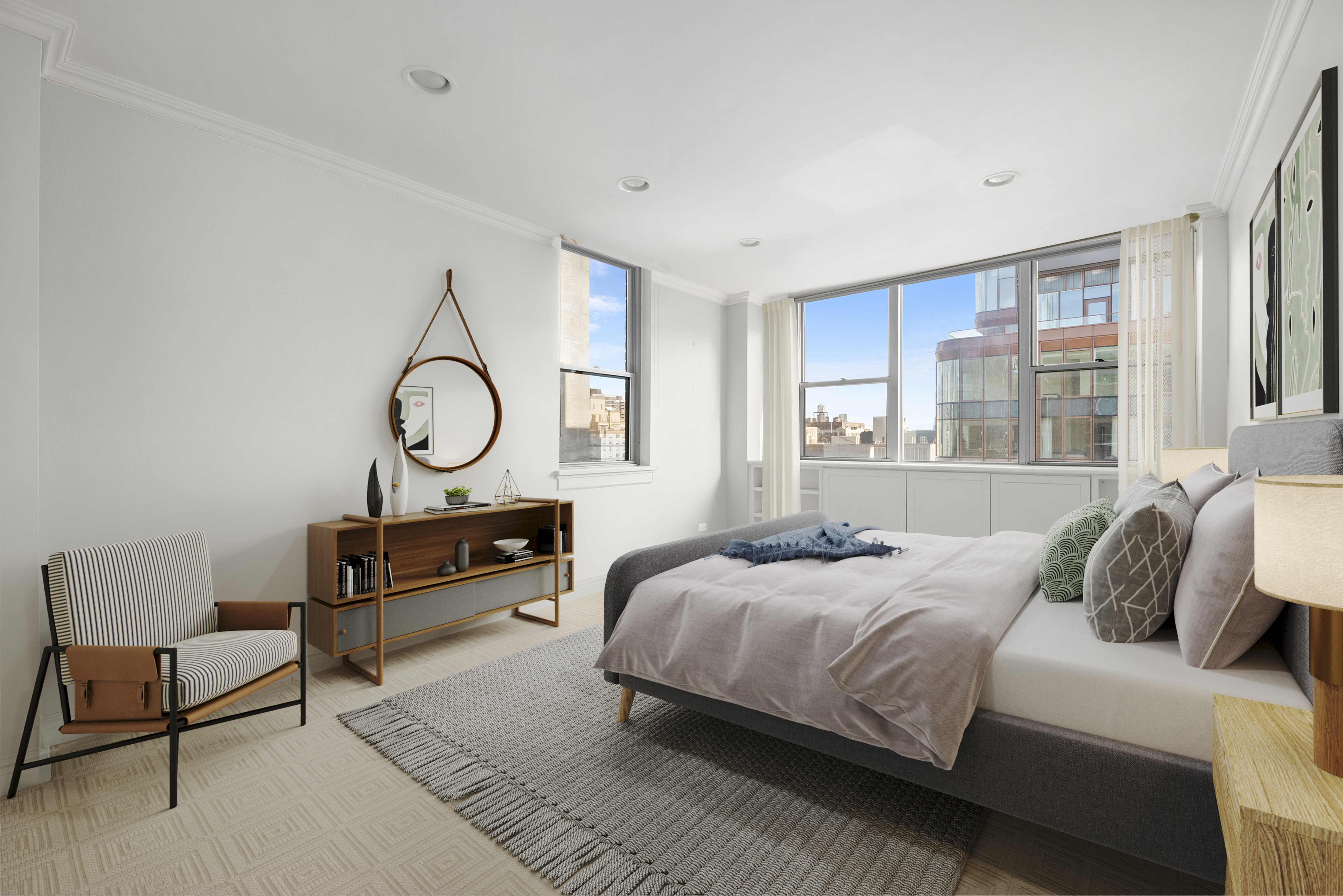 32 Gramercy Park South, Unit 15G Manhattan, NY 10003 - Photo 6 of 11 a bedroom with a bed a mirror and a large window with outer view