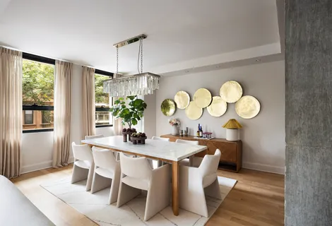 a dining room with a table and chairs