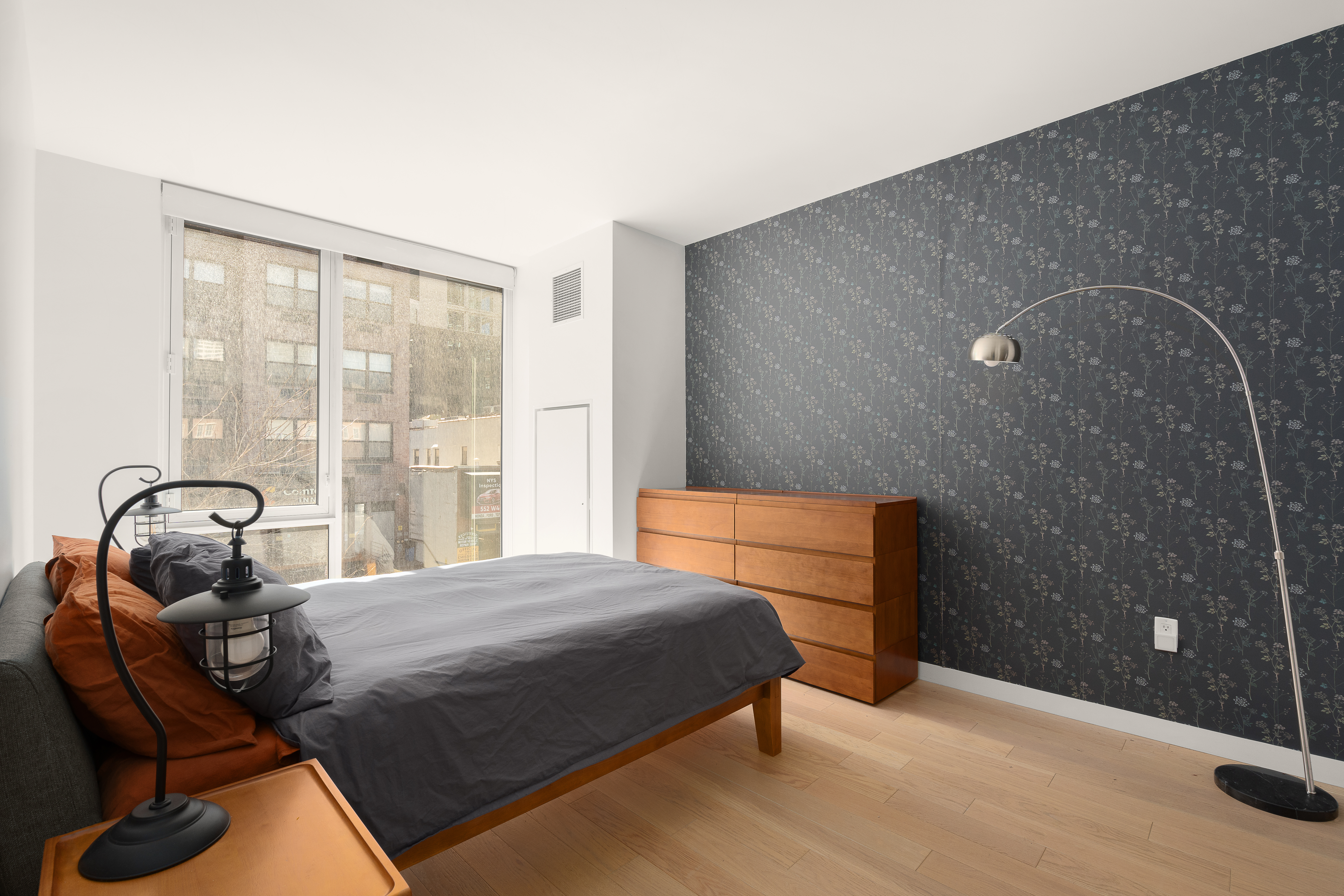 545 West 48th Street, Unit 308S Manhattan, NY 10036 - Photo 4 of 8 a bedroom with a bed and a window