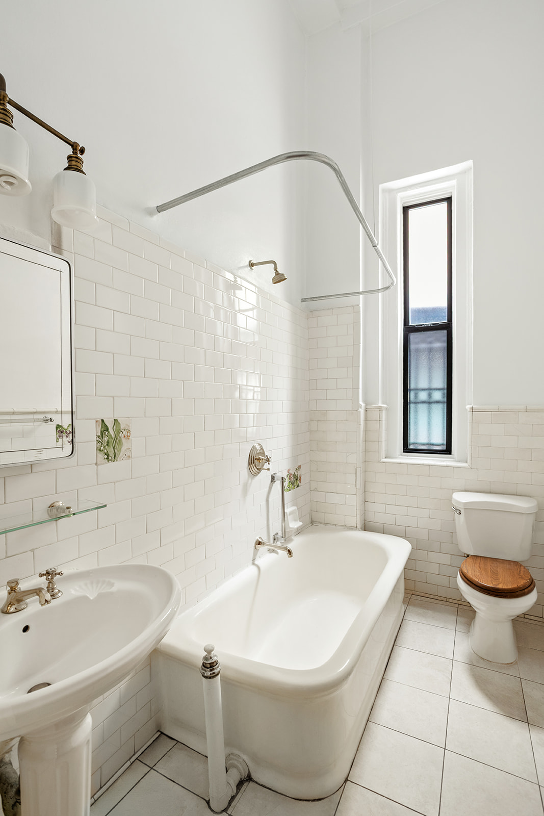 885 West End Avenue, Unit GC Manhattan, NY 10025 - Photo 8 of 13 a bathroom with a sink a toilet and shower