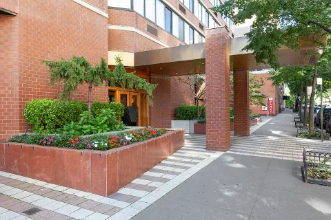a view of a fountain in front of a house