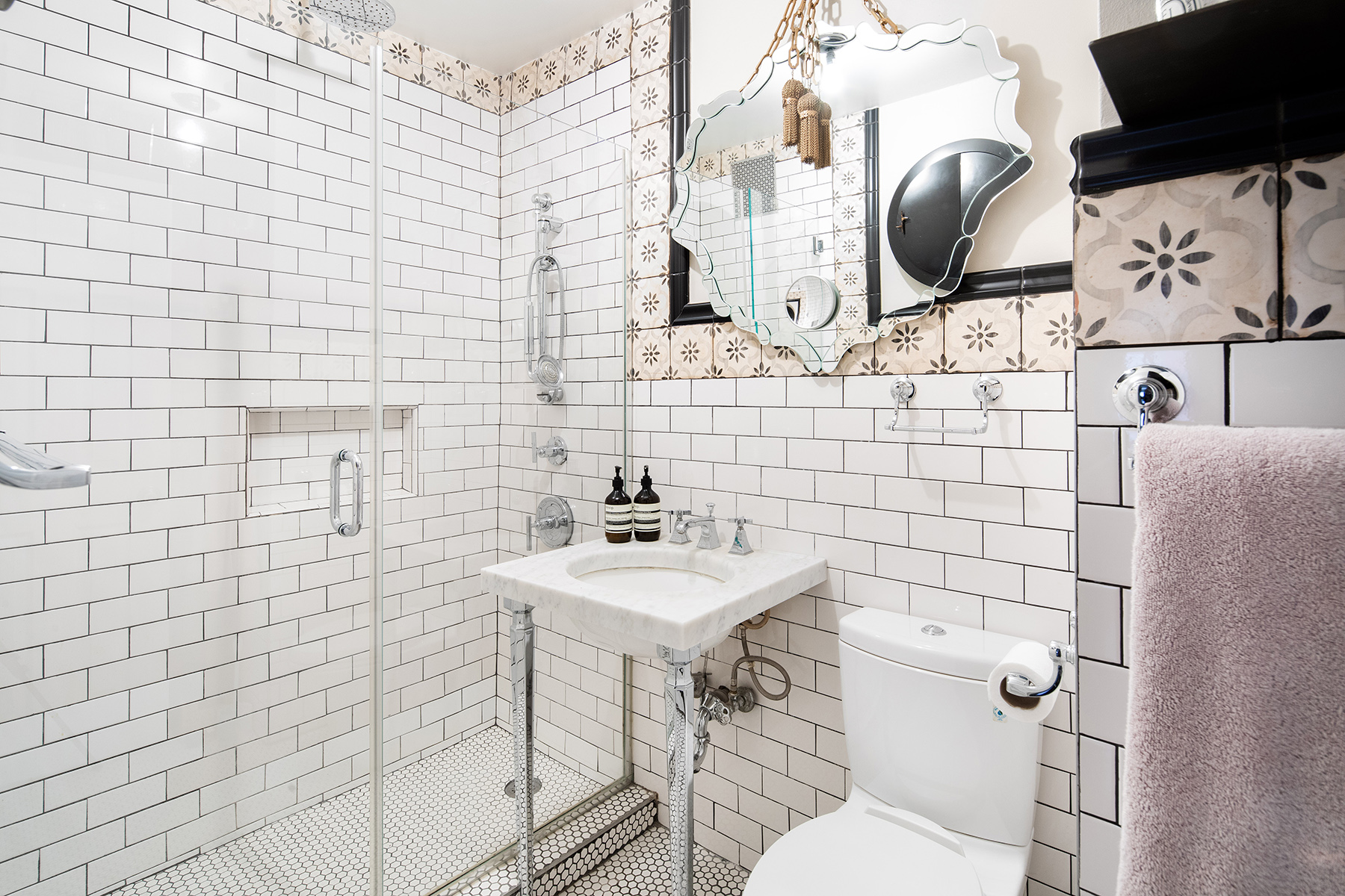 32 Downing Street, Unit 2D Manhattan, NY 10014 - Photo 7 of 9 a bathroom with a sink toilet and shower
