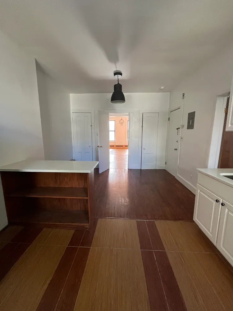 a view of entryway with wooden floor