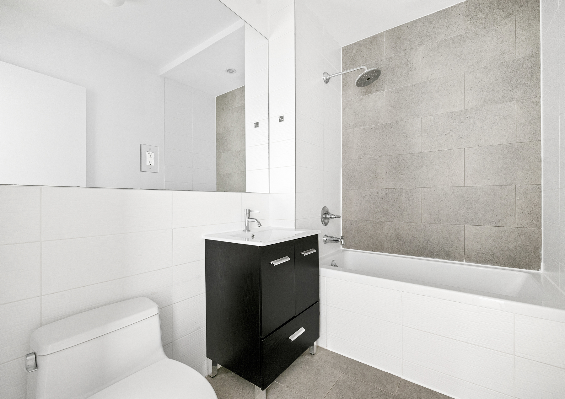 177 Concord Street, Unit 2C Brooklyn, NY 11201 - Photo 6 of 7 a bathroom with a toilet sink and mirror