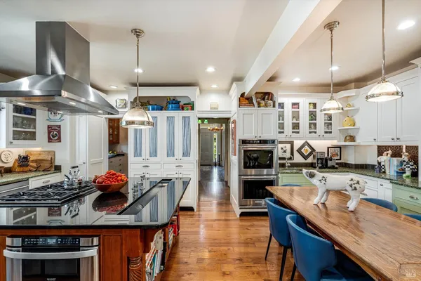 a view of a hallway with entryway wooden floor and front door