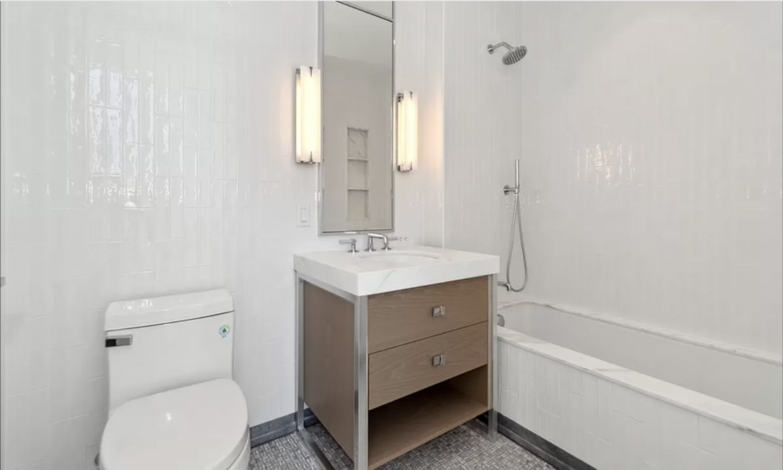 368 3rd Avenue, Unit 32B Manhattan, NY 10016 - Photo 18 of 19 a bathroom with a sink a toilet and shower