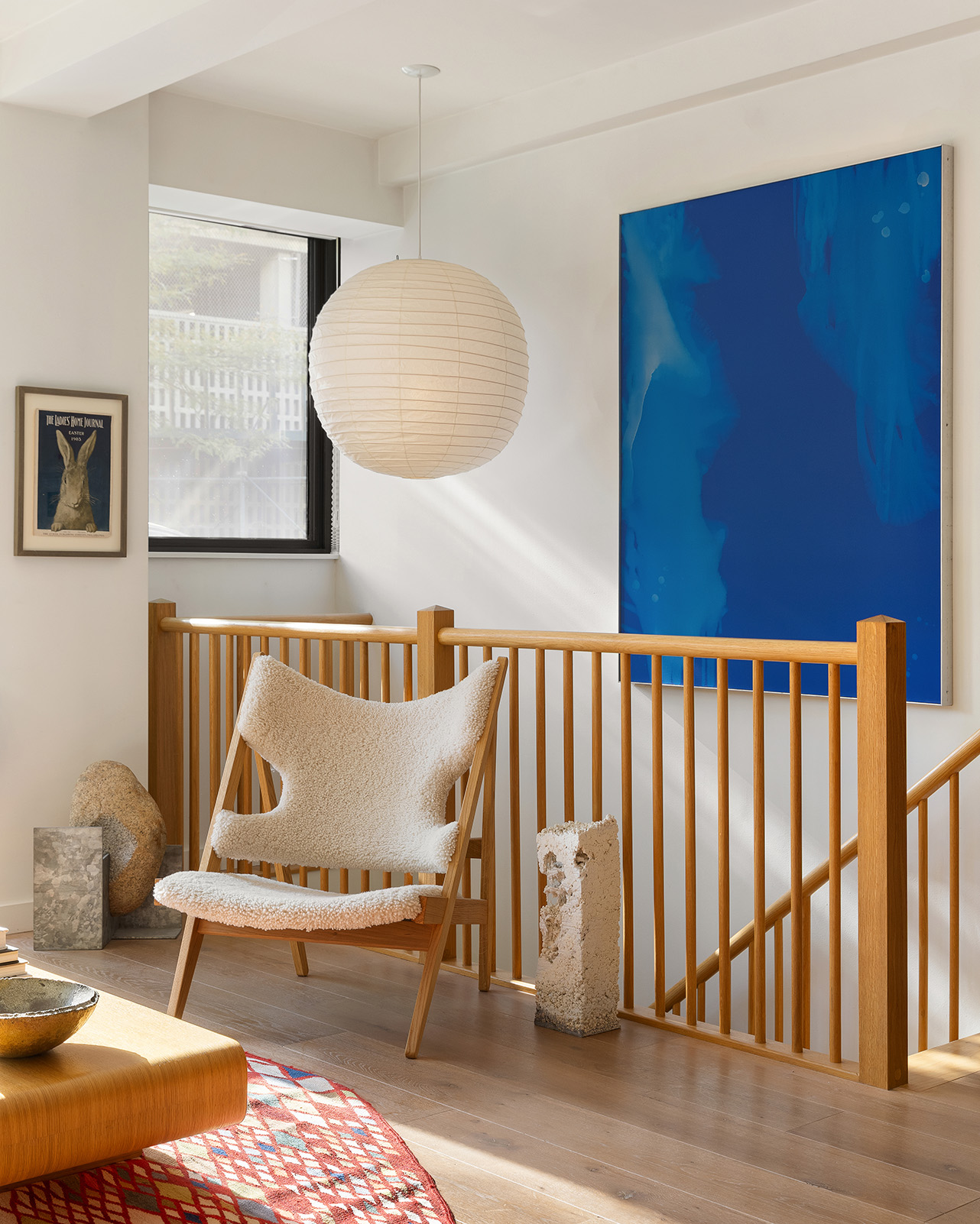 20 Henry Street, Unit 1BN Brooklyn, NY 11201 - Photo 6 of 15 a living room with a couch and paintings on the wall