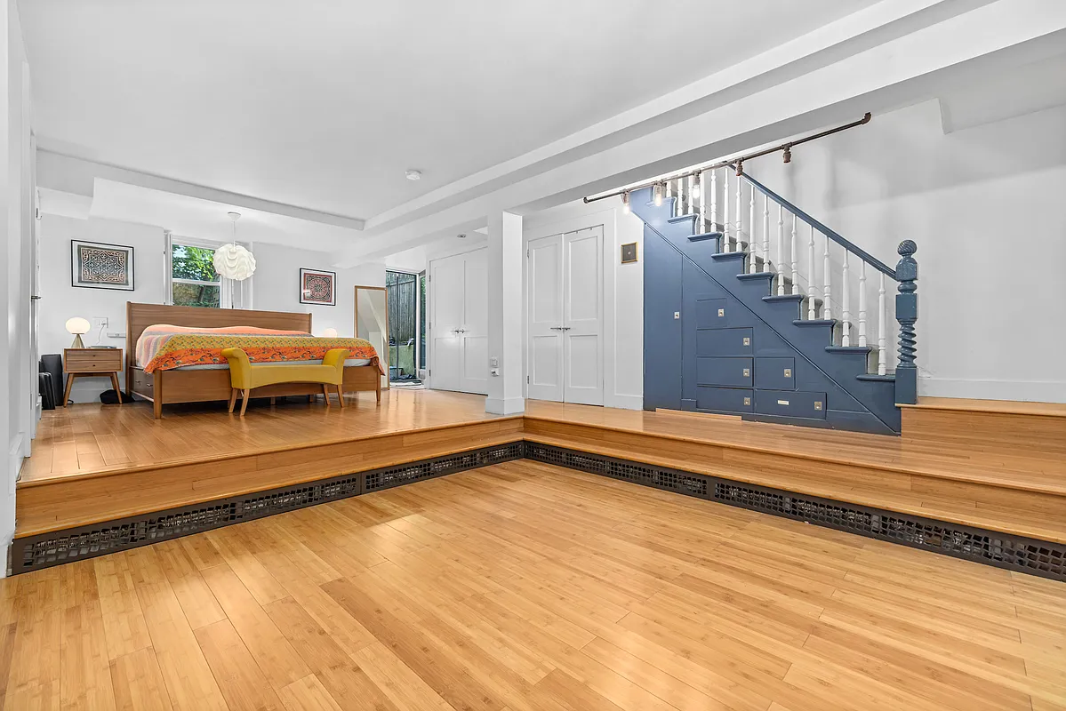 155 Luquer Street, Unit 1 Brooklyn, NY 11231 - Photo 6 of 13 a living room with furniture and a rug