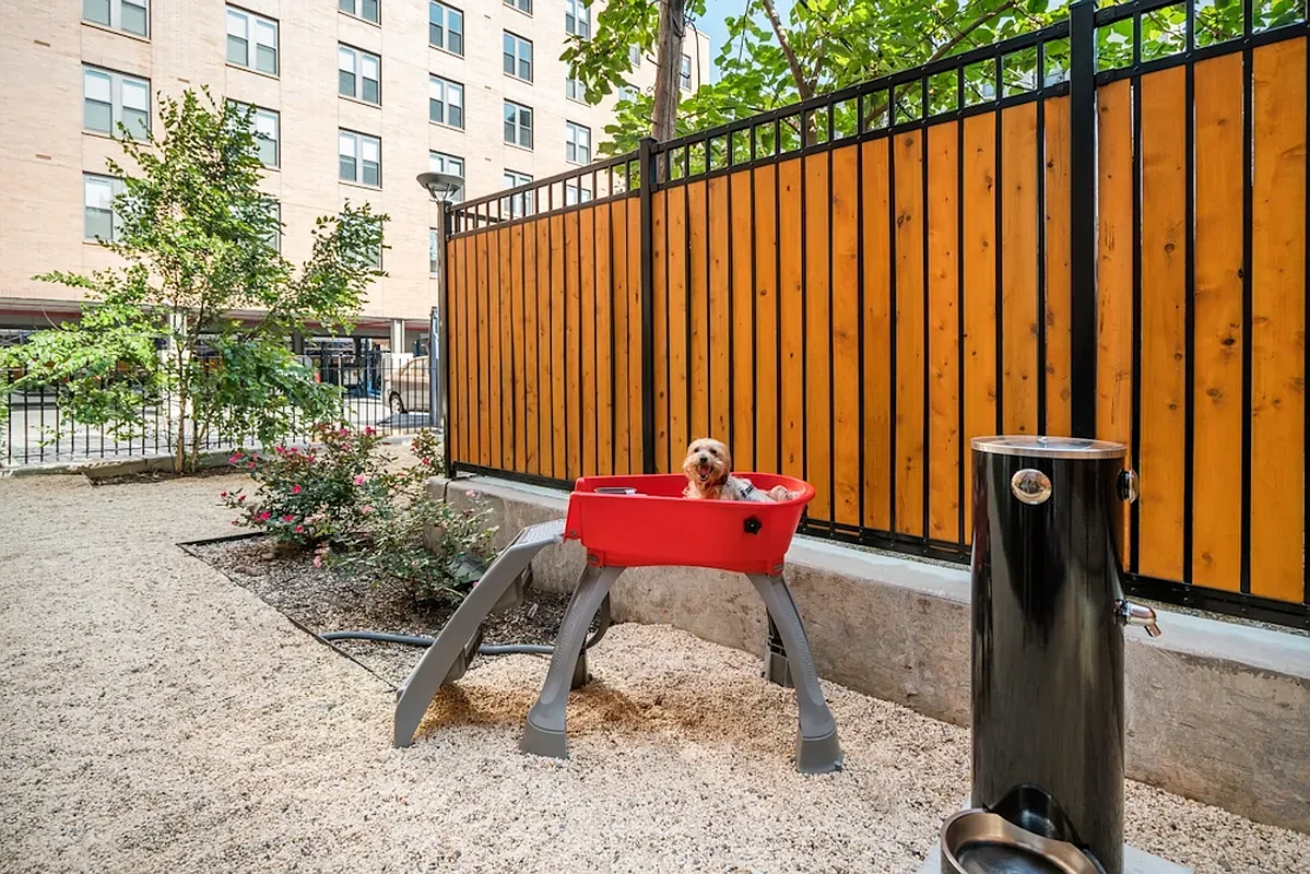 a view of a patio with a table and chairs