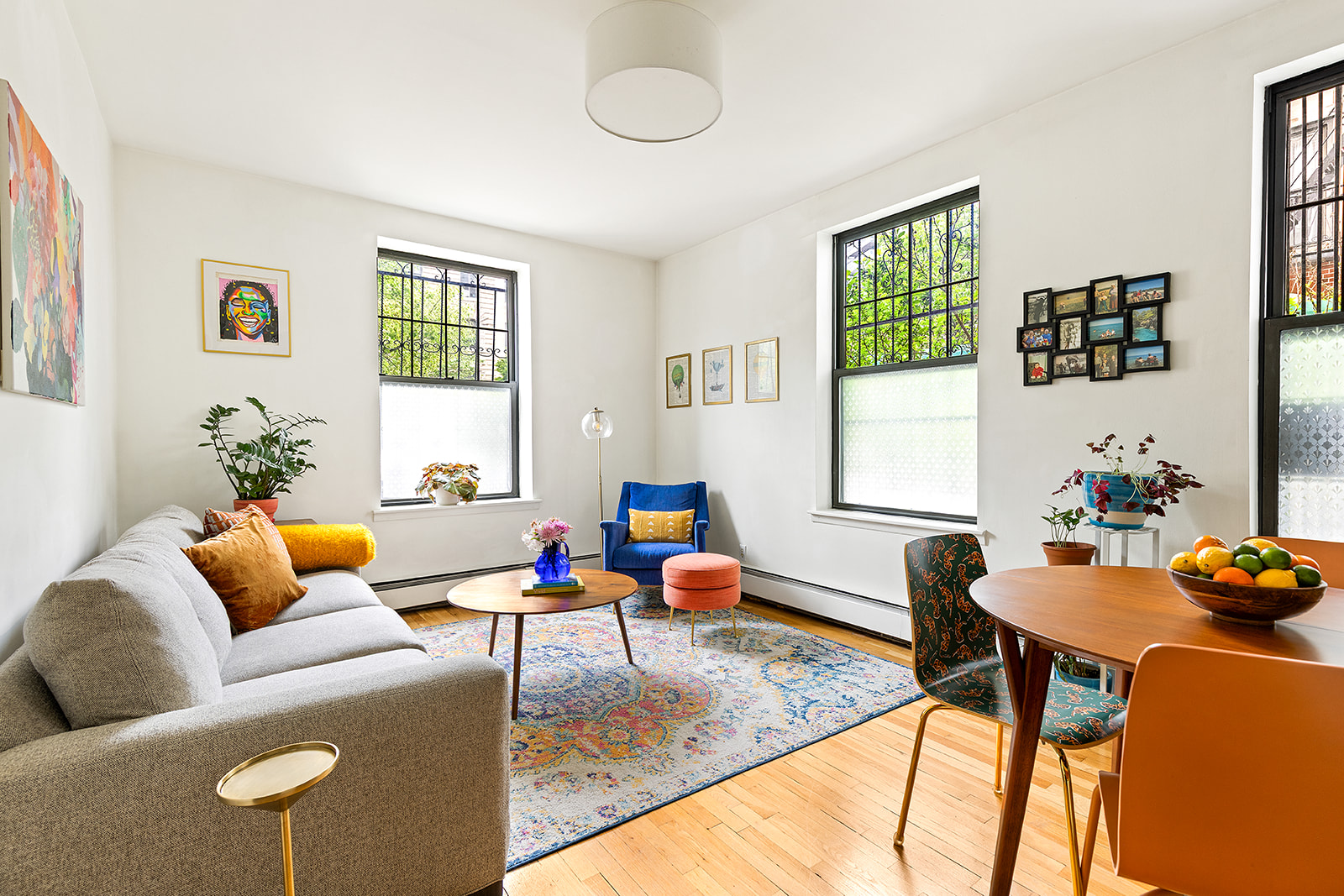 295 St Johns Place, Unit 1A Brooklyn, NY 11238 - Photo 1 of 13 a living room with furniture and wooden floor