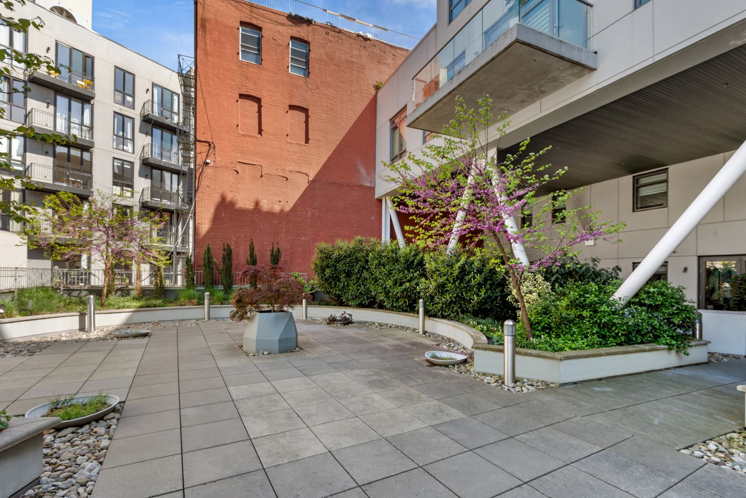 147 Hope Street, Unit 4I Brooklyn, NY 11211 - Photo 13 of 16 a view of a street with potted plants