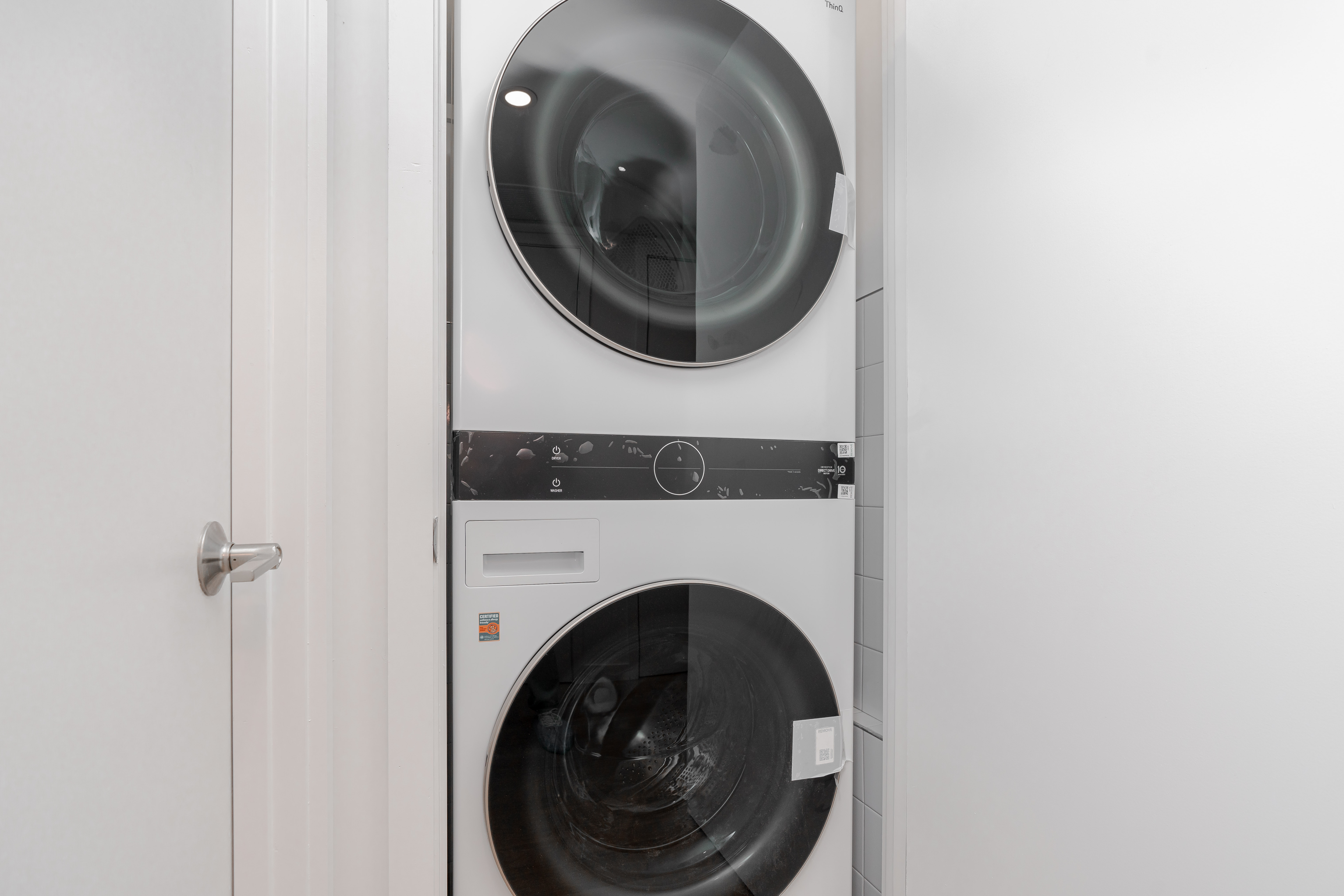 20-15 46th Street, Unit 2 Queens, NY 11105 - Photo 7 of 16 a utility room with dryer and washer