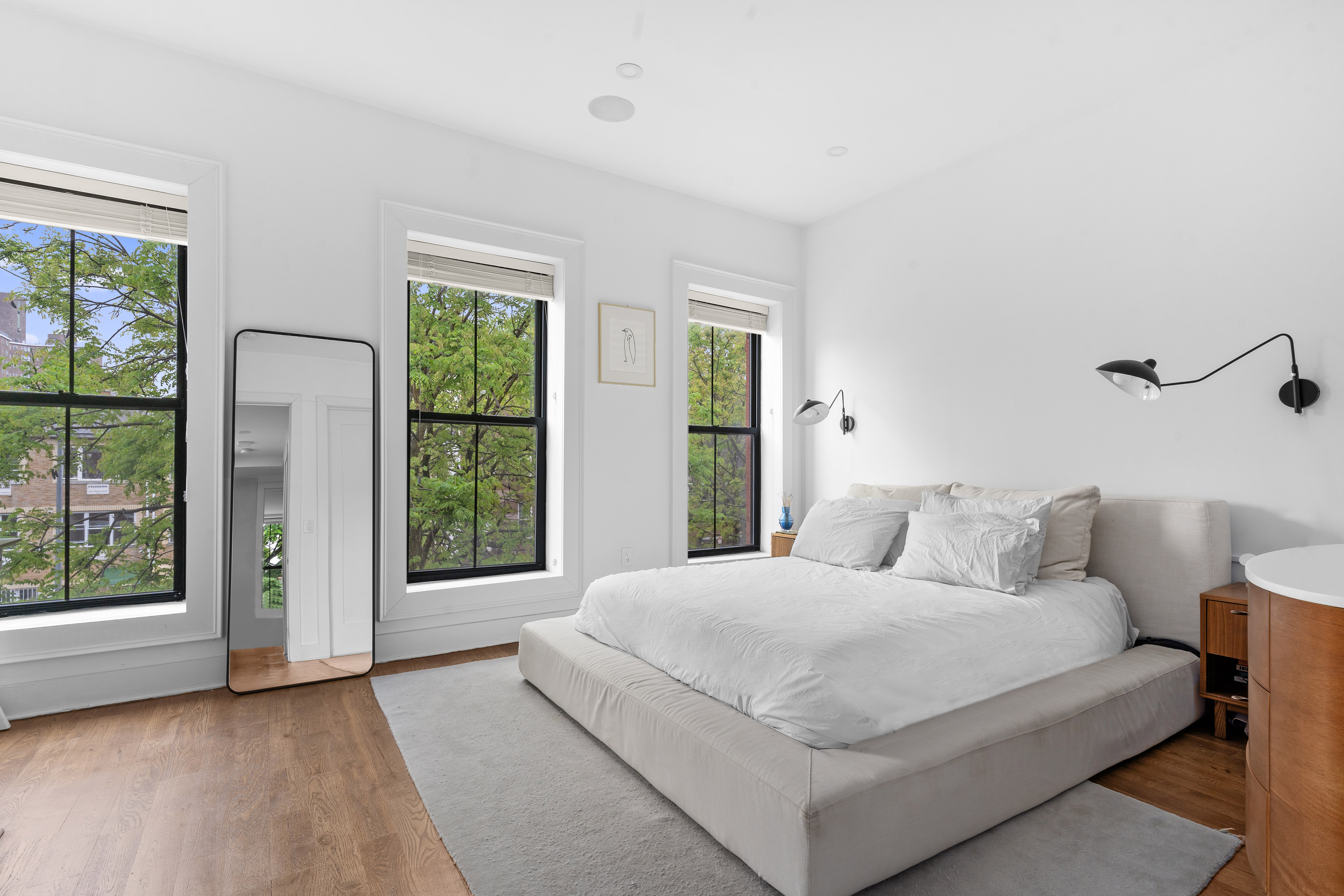 1591 Pacific Street Brooklyn, NY 11213 - Photo 6 of 16 a bedroom with a large bed and a large window