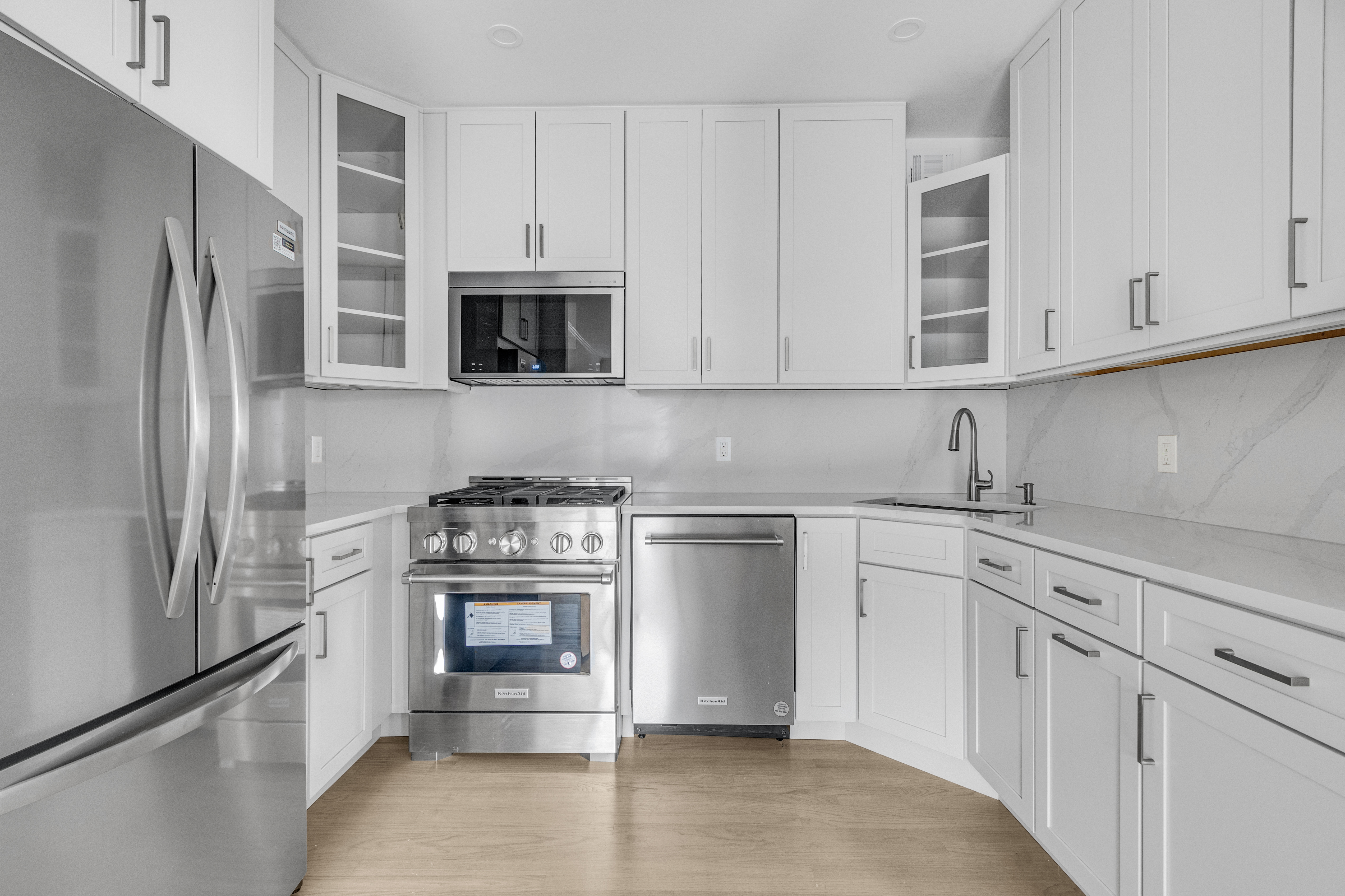 305 West 98th Street, Unit 7CS Manhattan, NY 10025 - Photo 5 of 18 a kitchen with cabinets stainless steel appliances and sink