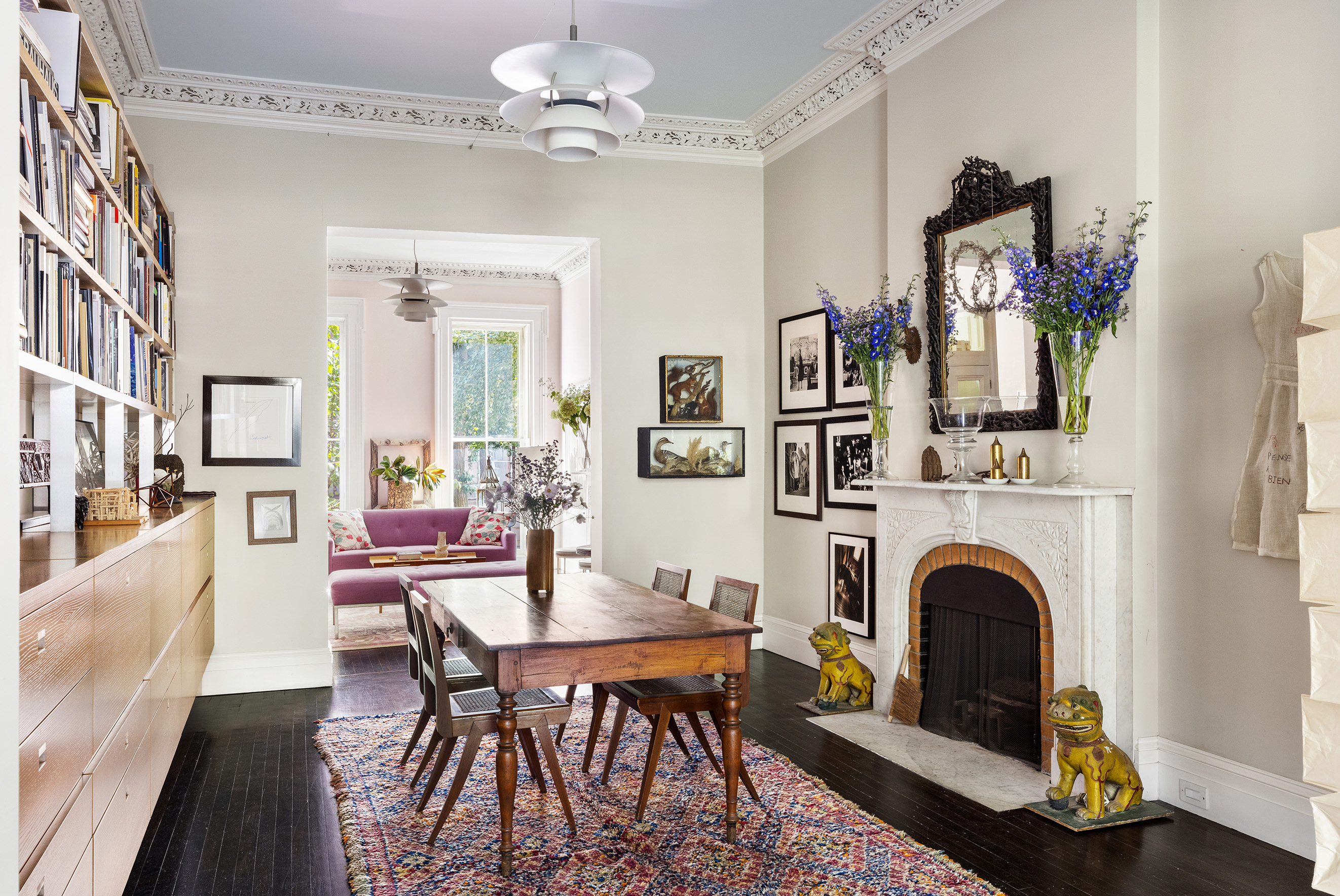 25 Perry Street Manhattan, NY 10014 - Photo 5 of 32 a view of a livingroom with furniture a fireplace and wooden floor