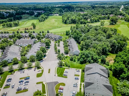 an aerial view of residential house with outdoor space and lake view