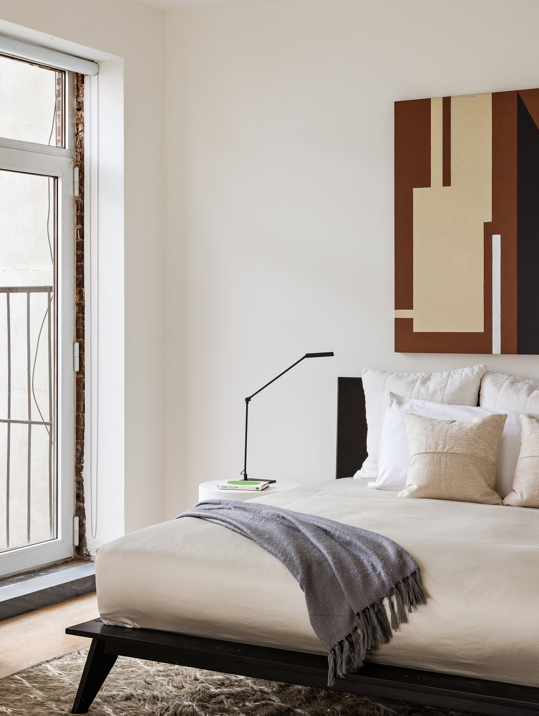 169 Mercer Street, Unit PH Manhattan, NY 10012 - Photo 9 of 15 a bedroom with a bed and a window