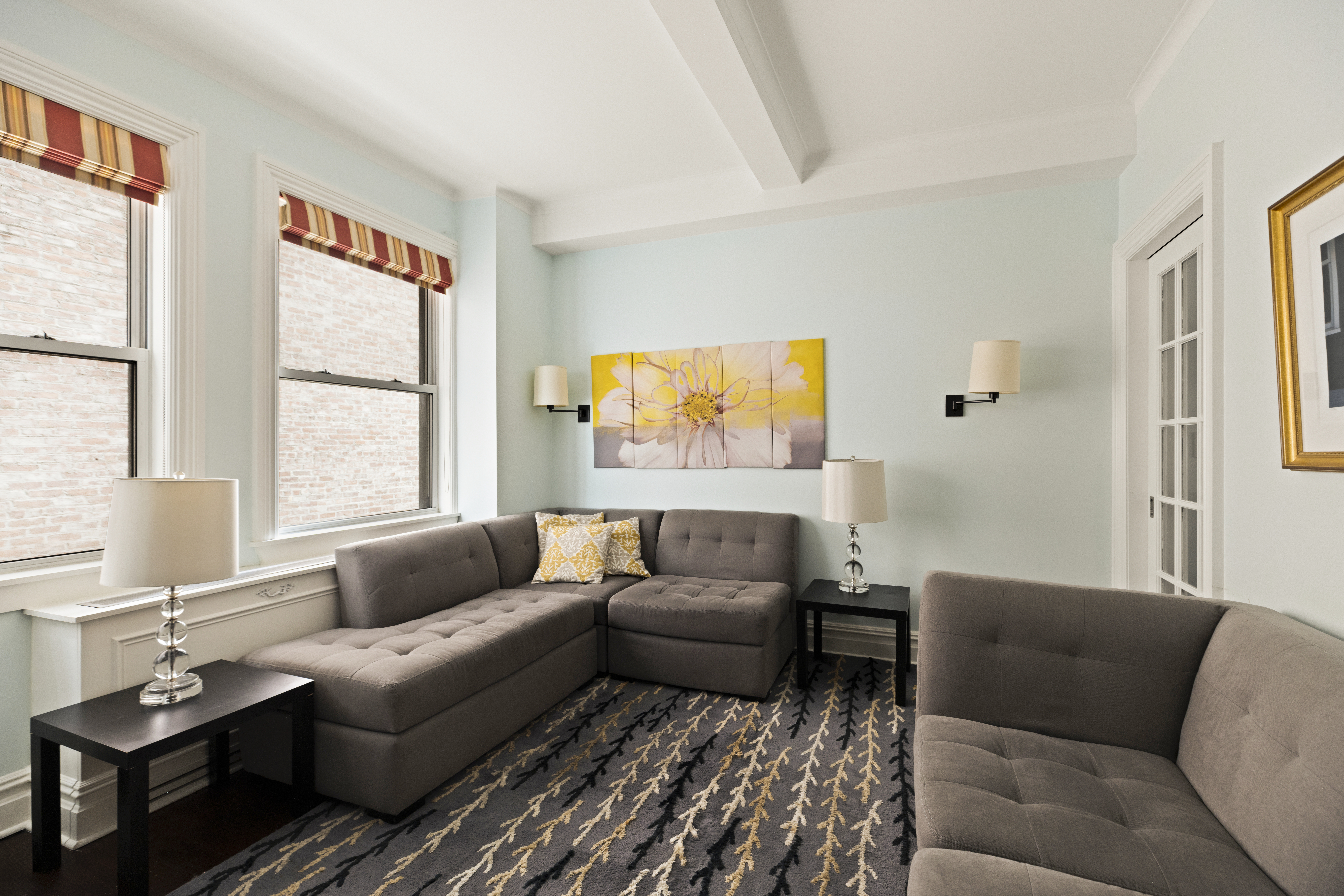 1158 5th Avenue, Unit 4A Manhattan, NY 10128 - Photo 15 of 24 a living room with furniture and a window
