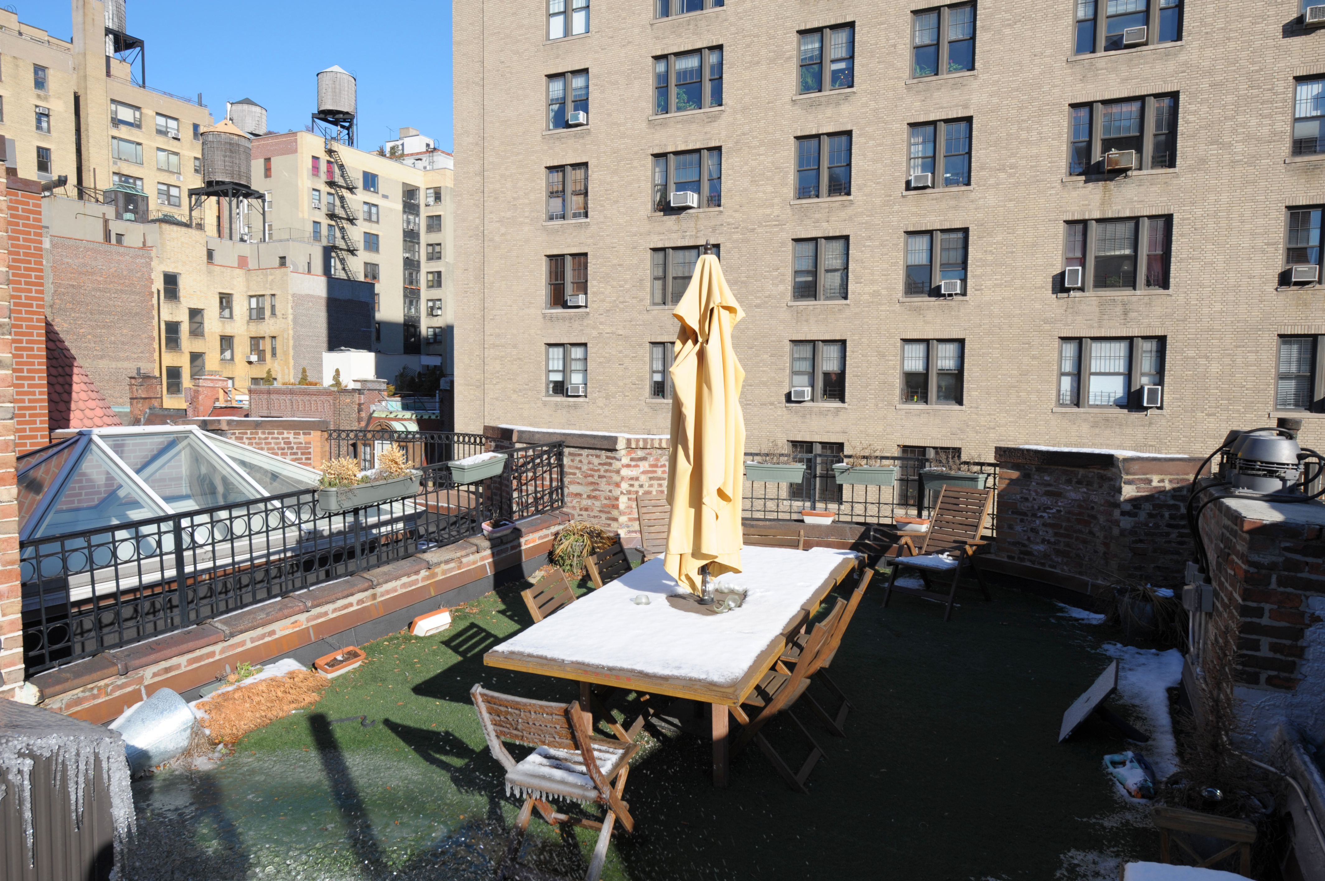 304 West 77th Street, Unit 2 Manhattan, NY 10024 - Photo 4 of 6 a view of a city from a dining room with furniture