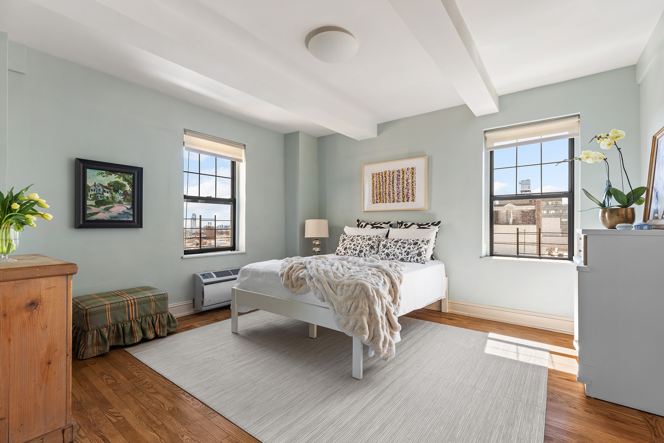 200 East 16th Street, Unit 19D Manhattan, NY 10003 - Photo 9 of 14 a bedroom with a bed and a window