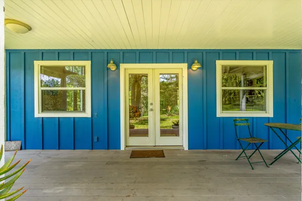 a view of a room with garden area and outdoor seating