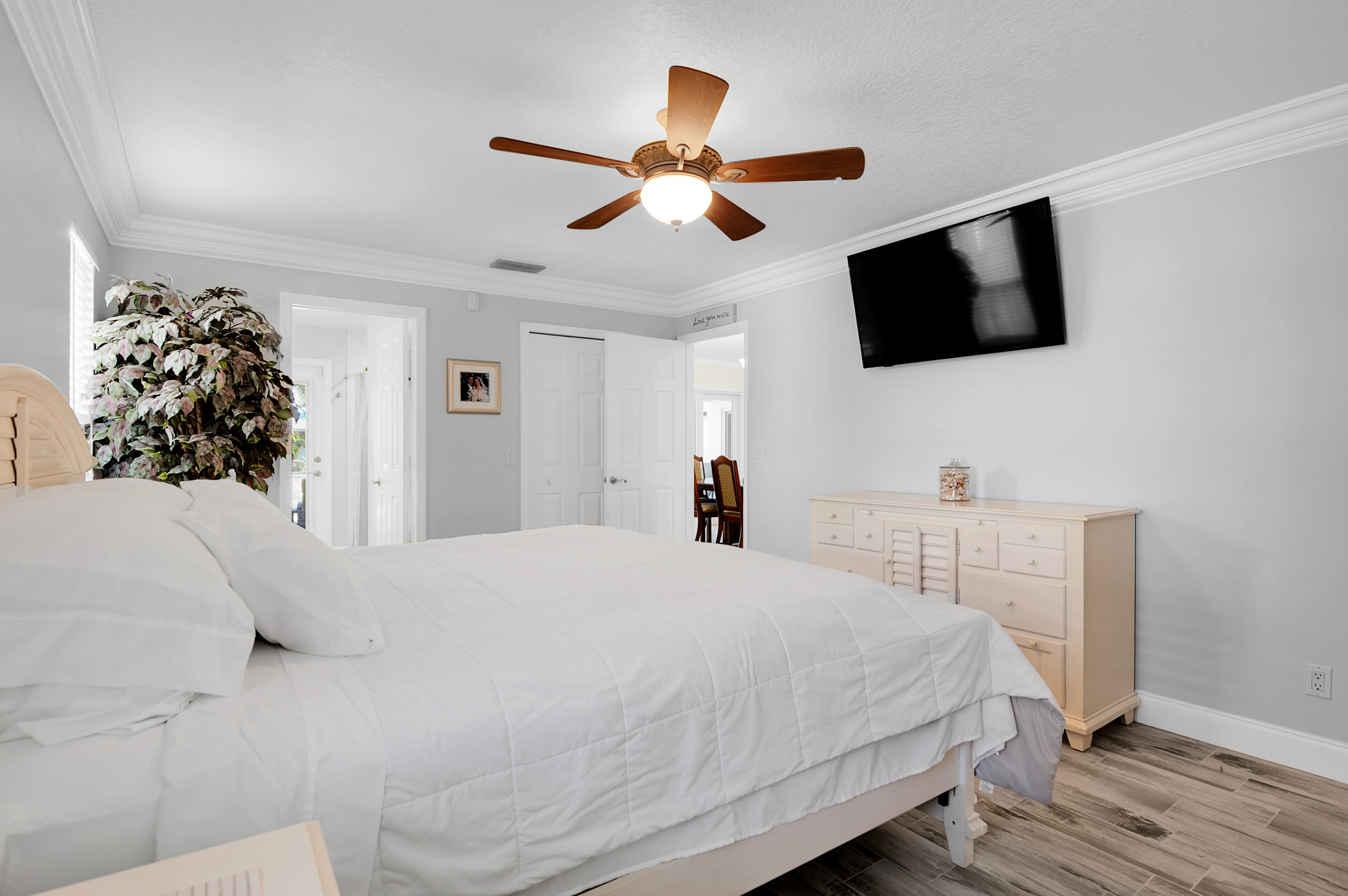 1560 Southwest 16th Street Boca Raton, FL 33486 - Photo 58 of 72 a bedroom with a bed and a flat screen tv