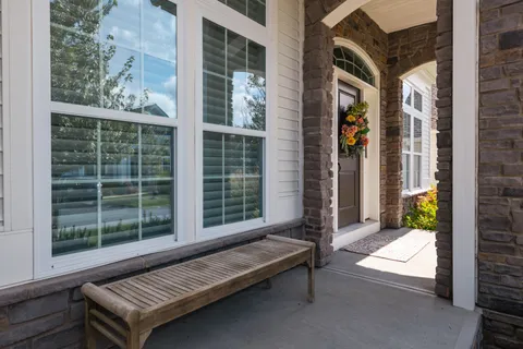 a building outdoor space with patio furniture and potted plant