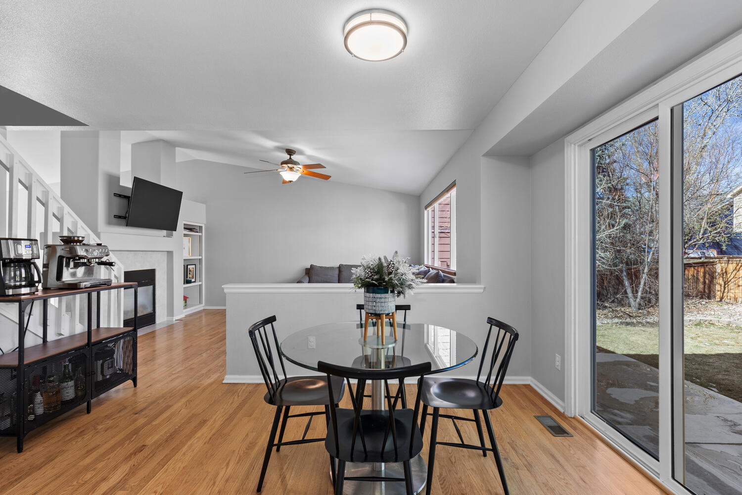 847 Timbervale Trail Highlands Ranch, CO 80129 - Photo 15 of 36 a view of a dining room with furniture window and wooden floor