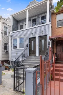 a view of a house with iron stairs