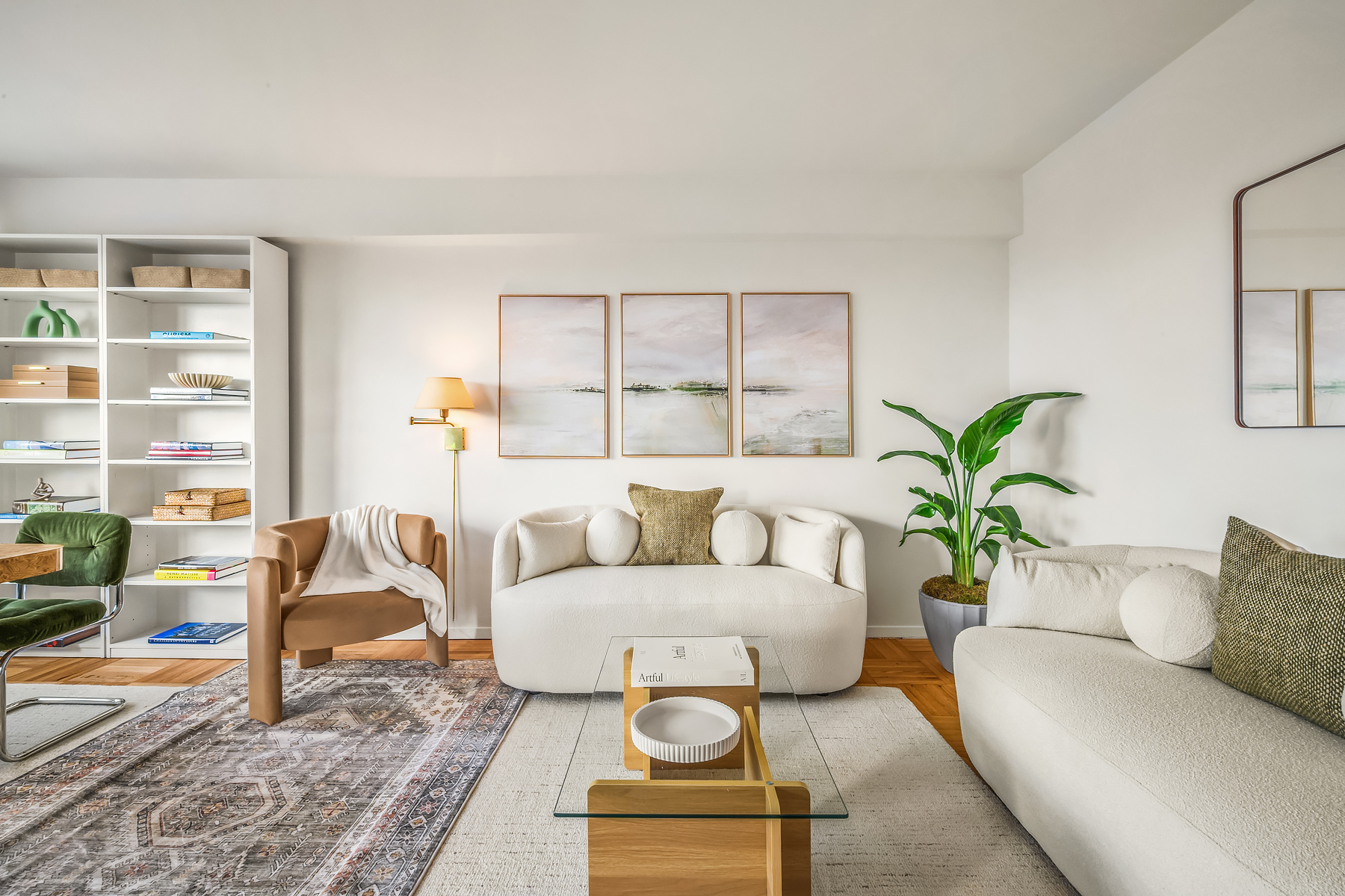 175 West 13th Street, Unit 19C Manhattan, NY 10011 - Photo 12 of 20 a living room with furniture and a potted plant