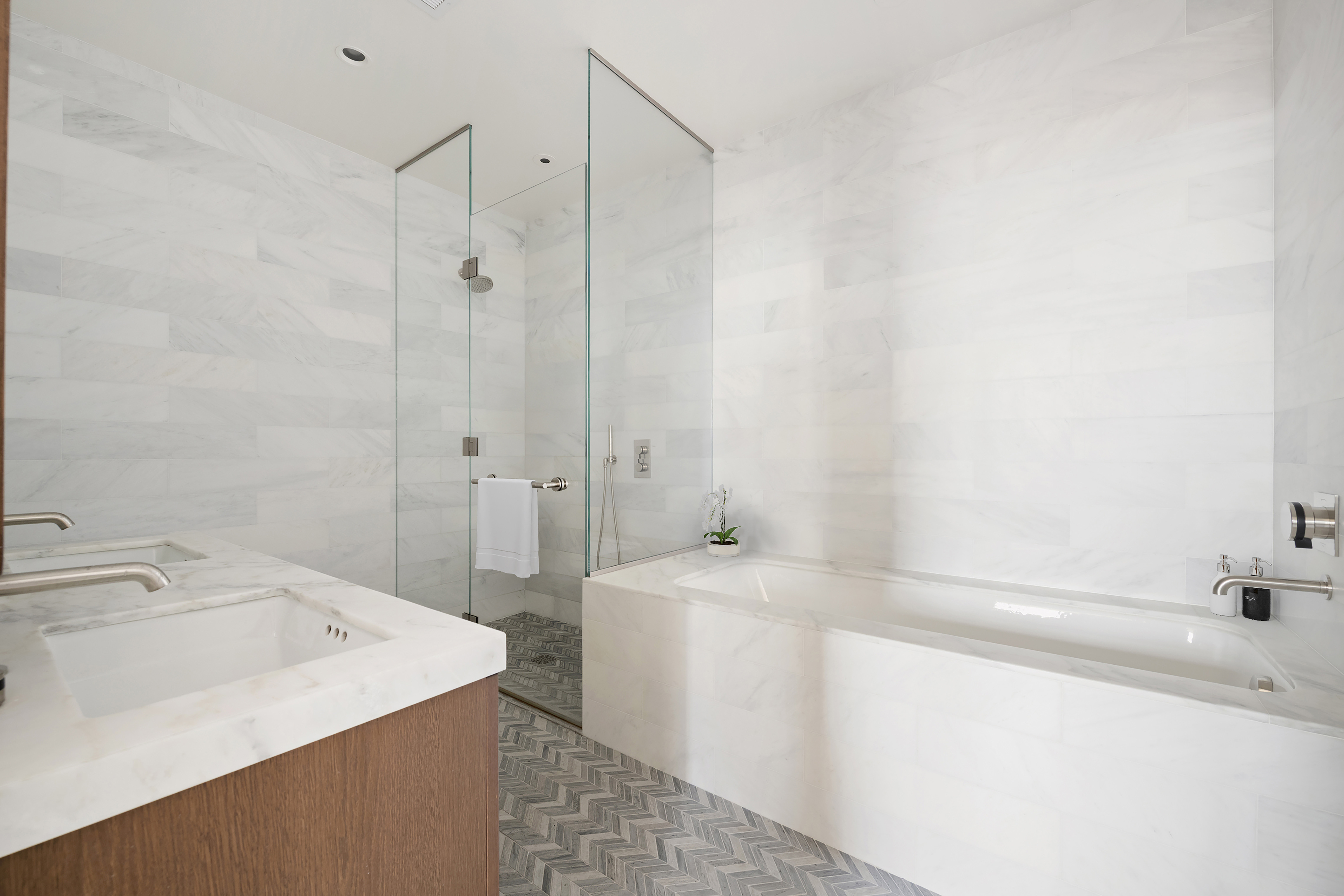 180 Front Street, Unit 7B Brooklyn, NY 11201 - Photo 6 of 25 a bathroom with a sink a bathtub and a shower