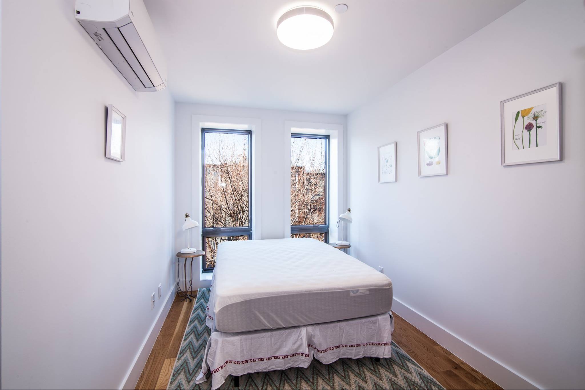 385 Jefferson Avenue, Unit C Brooklyn, NY 11221 - Photo 13 of 21 a room with a bed and a window