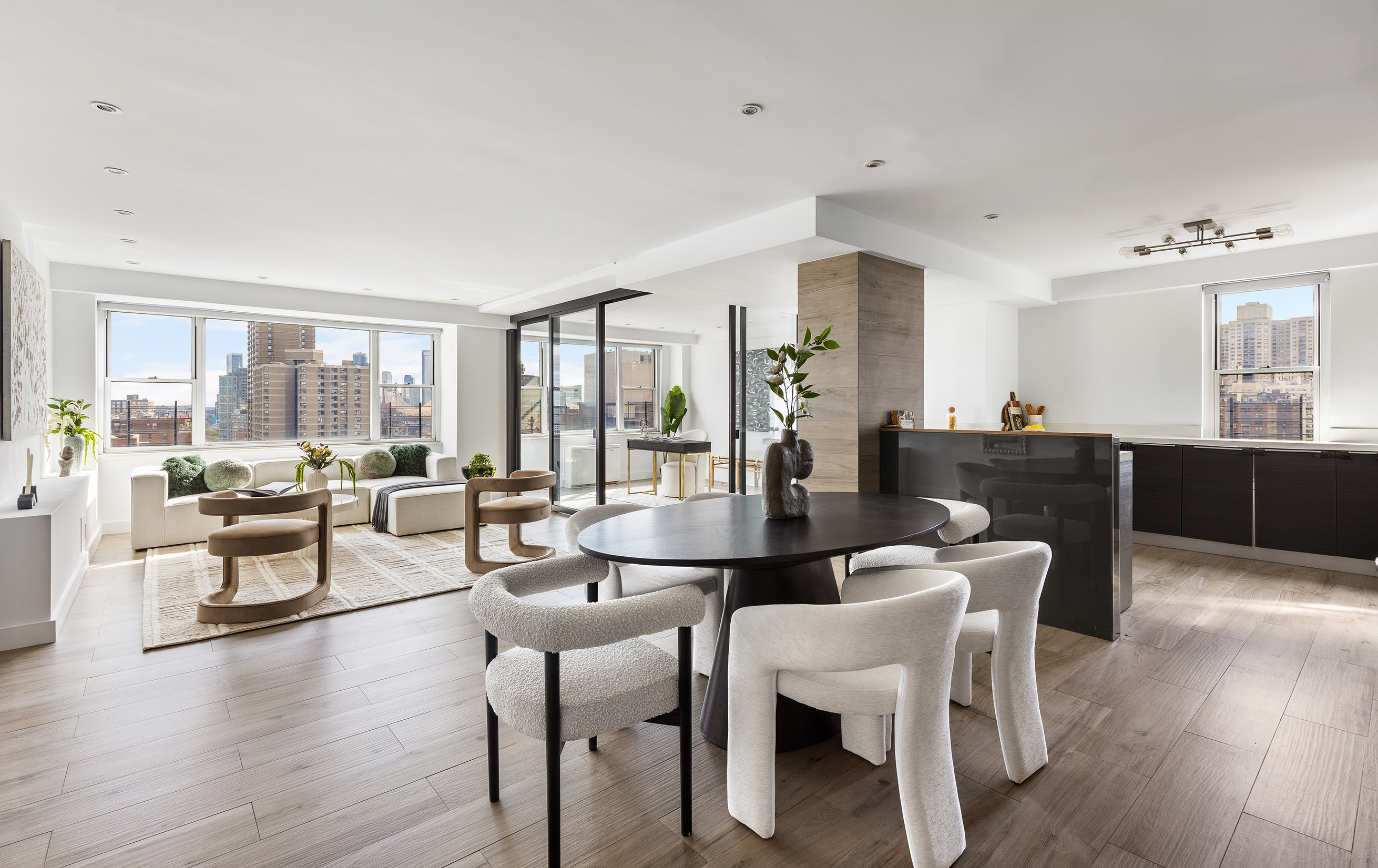 340 East 64th Street, Unit 19L Manhattan, NY 10065 - Photo 5 of 17 a view of a dining room with furniture and wooden floor