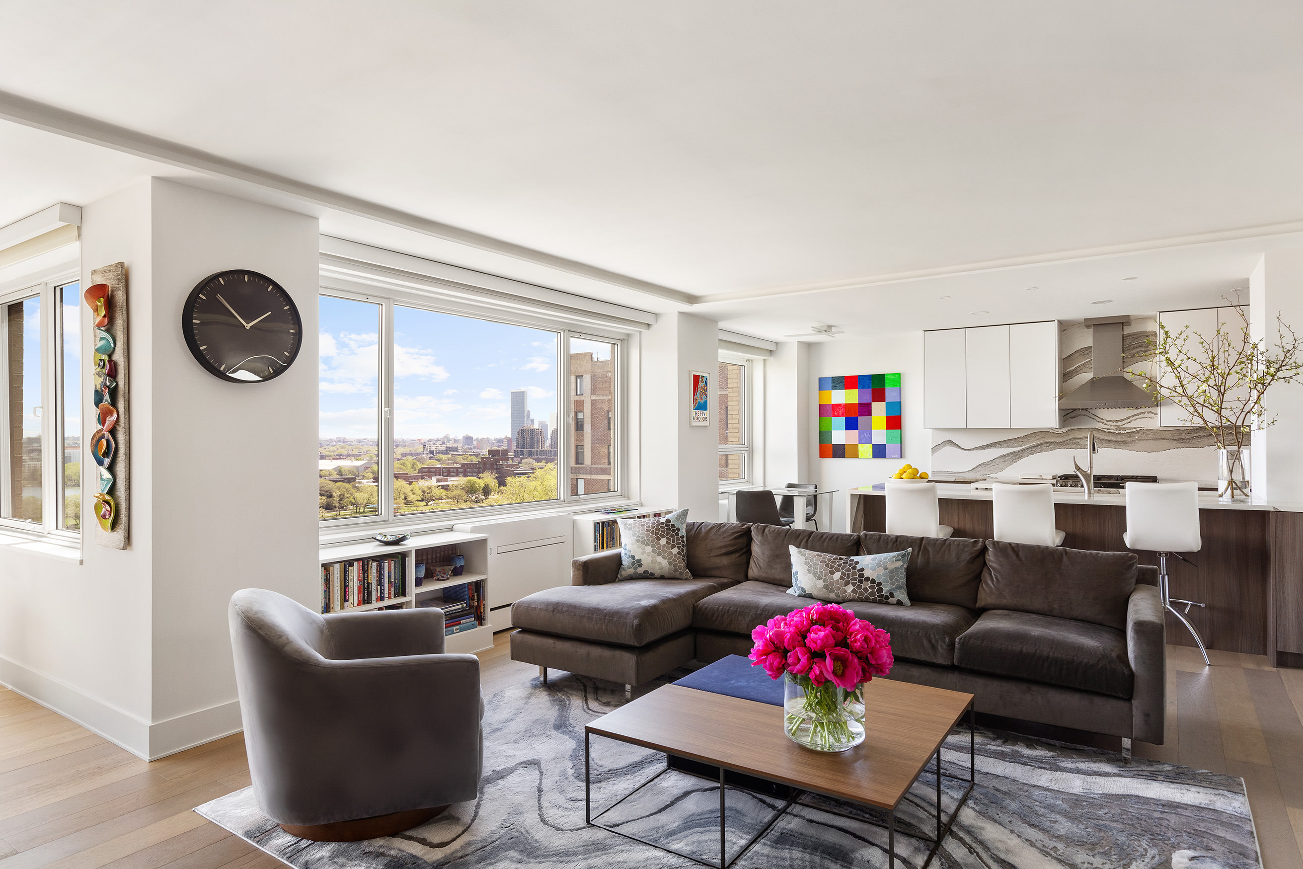 535 East 86th Street, Unit 16F Manhattan, NY 10028 - Photo 4 of 19 a living room with furniture and a large window