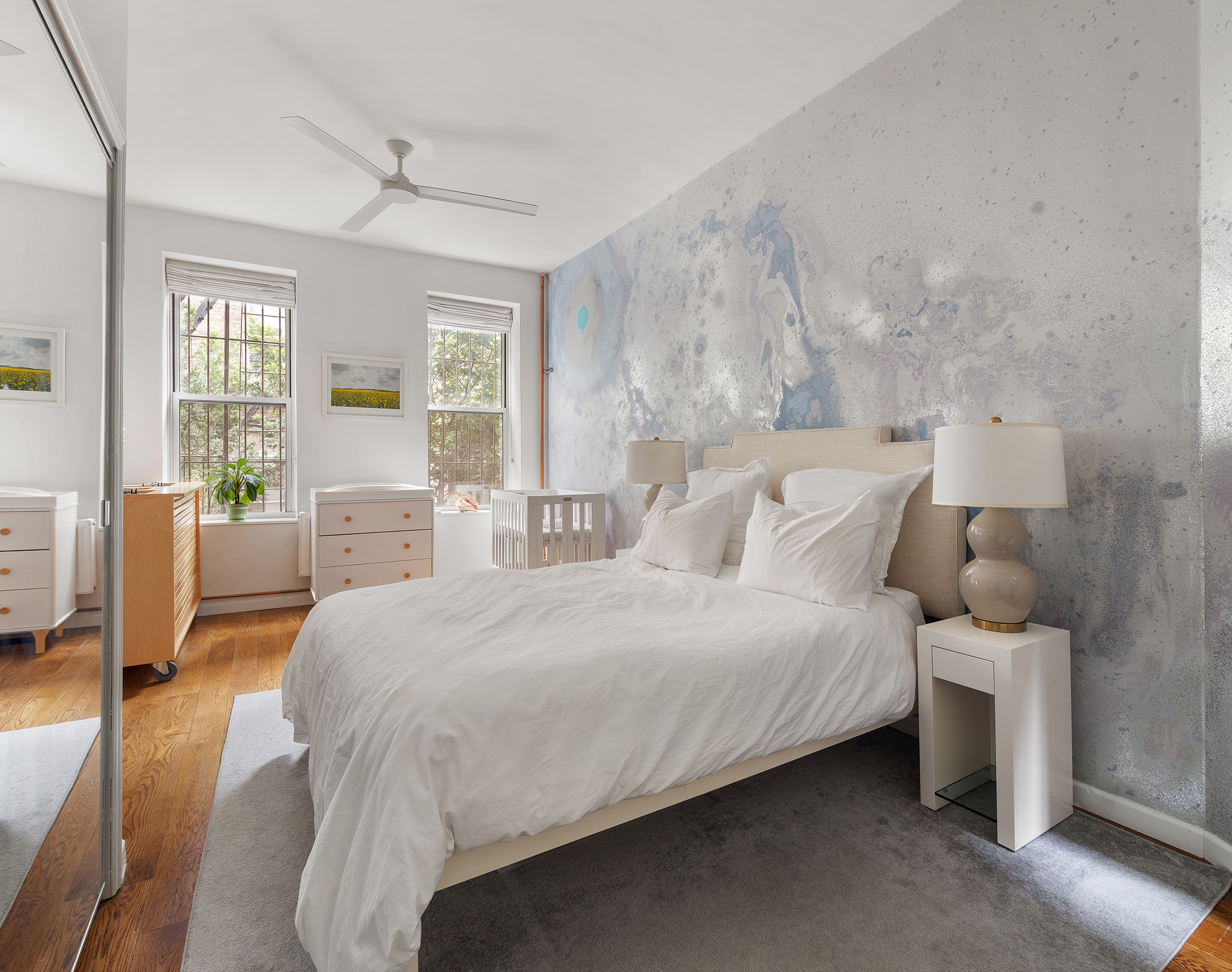 71 East 3rd Street, Unit 4 Manhattan, NY 10003 - Photo 8 of 18 a bedroom with a bed and wooden floor