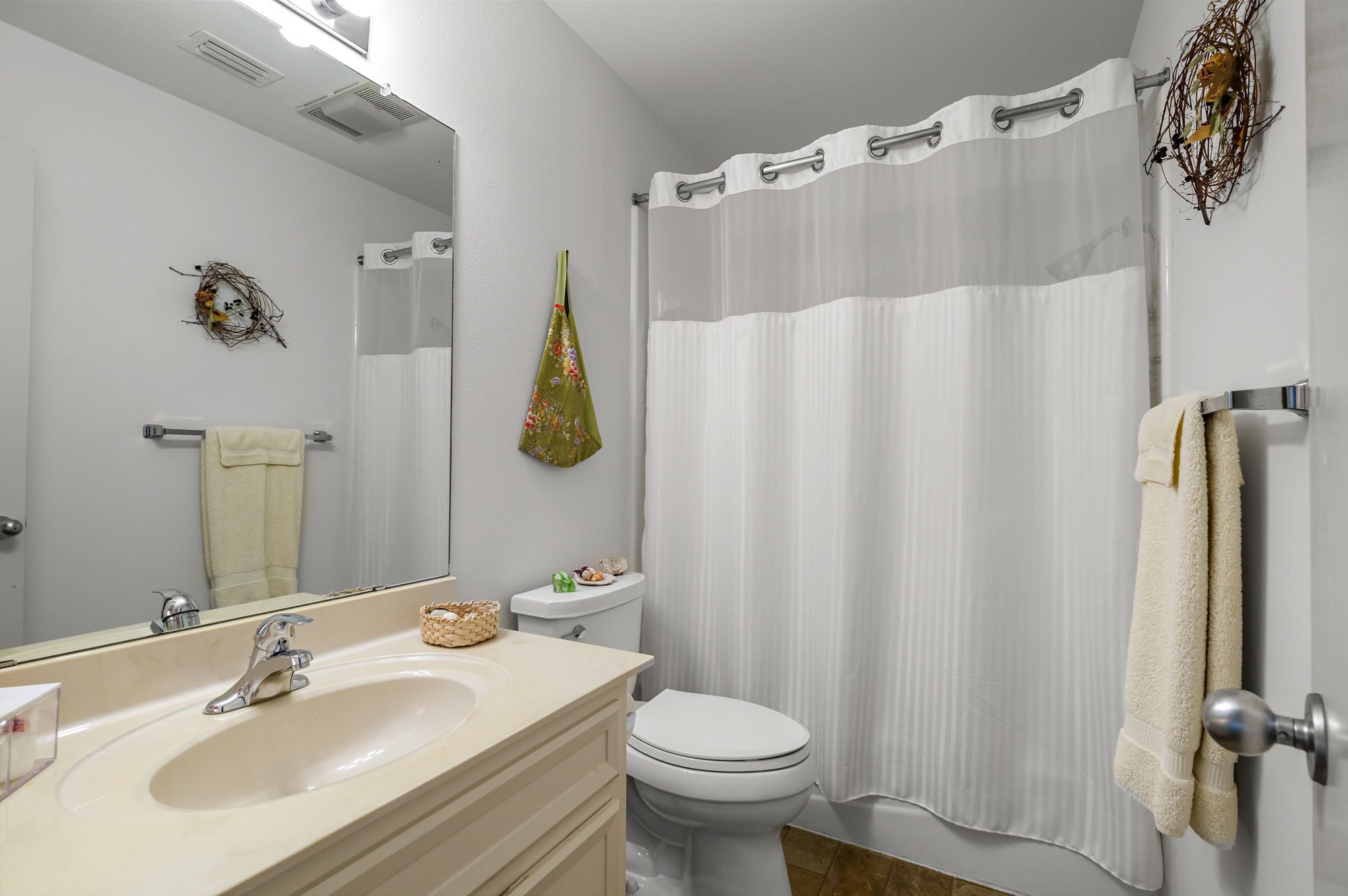 1605 The High Road Austin, TX 78746 - Photo 35 of 45 a bathroom with a sink and a mirror