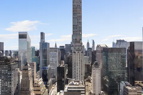 a view of a city with tall buildings