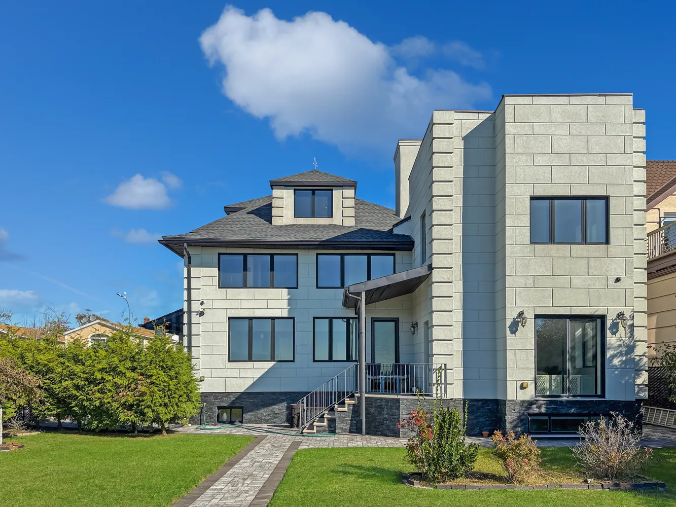 a front view of a house with garden