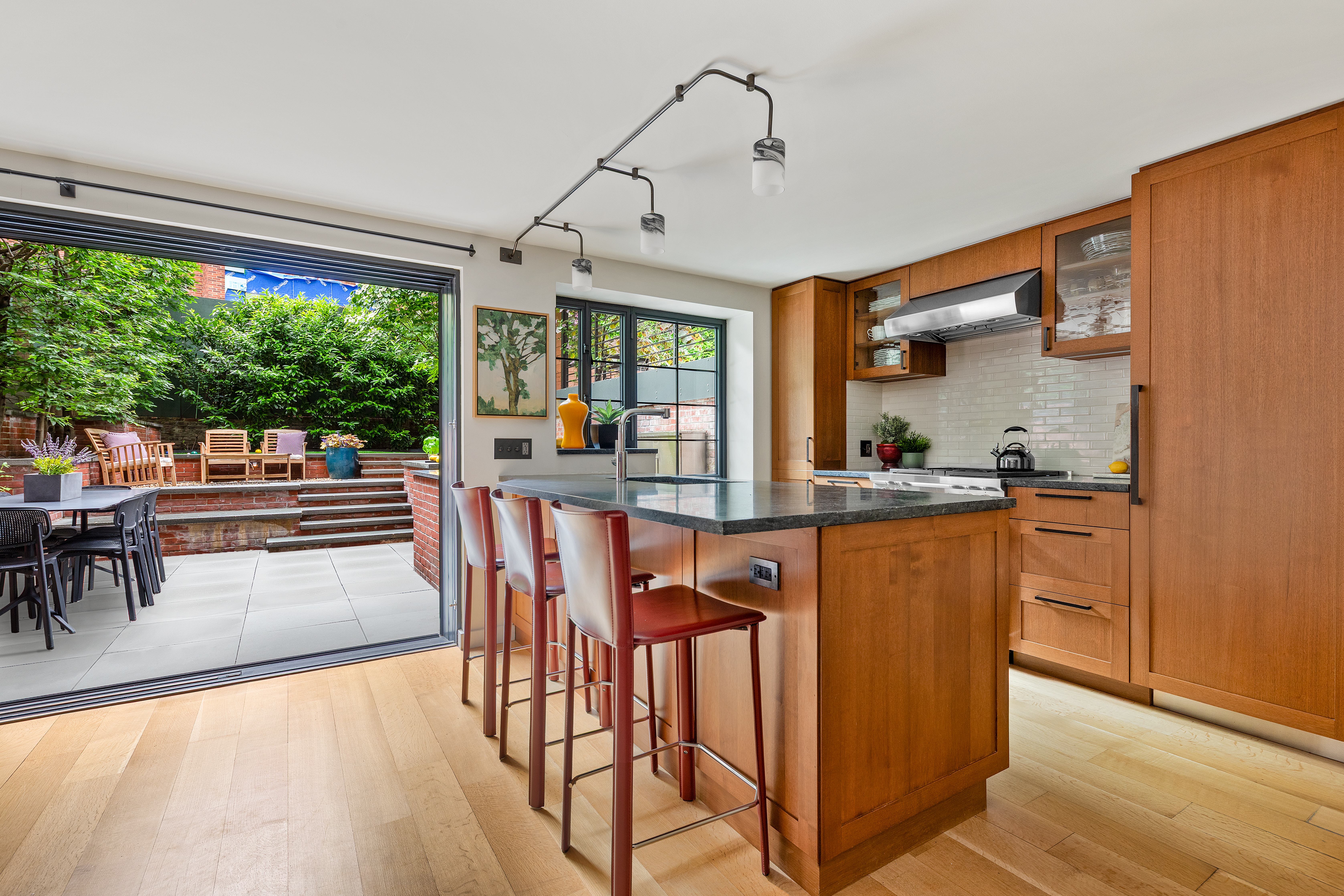 21 Bethune Street, Unit GARDEN Manhattan, NY 10014 - Photo 4 of 12 a view of a dining room with furniture window and outside view