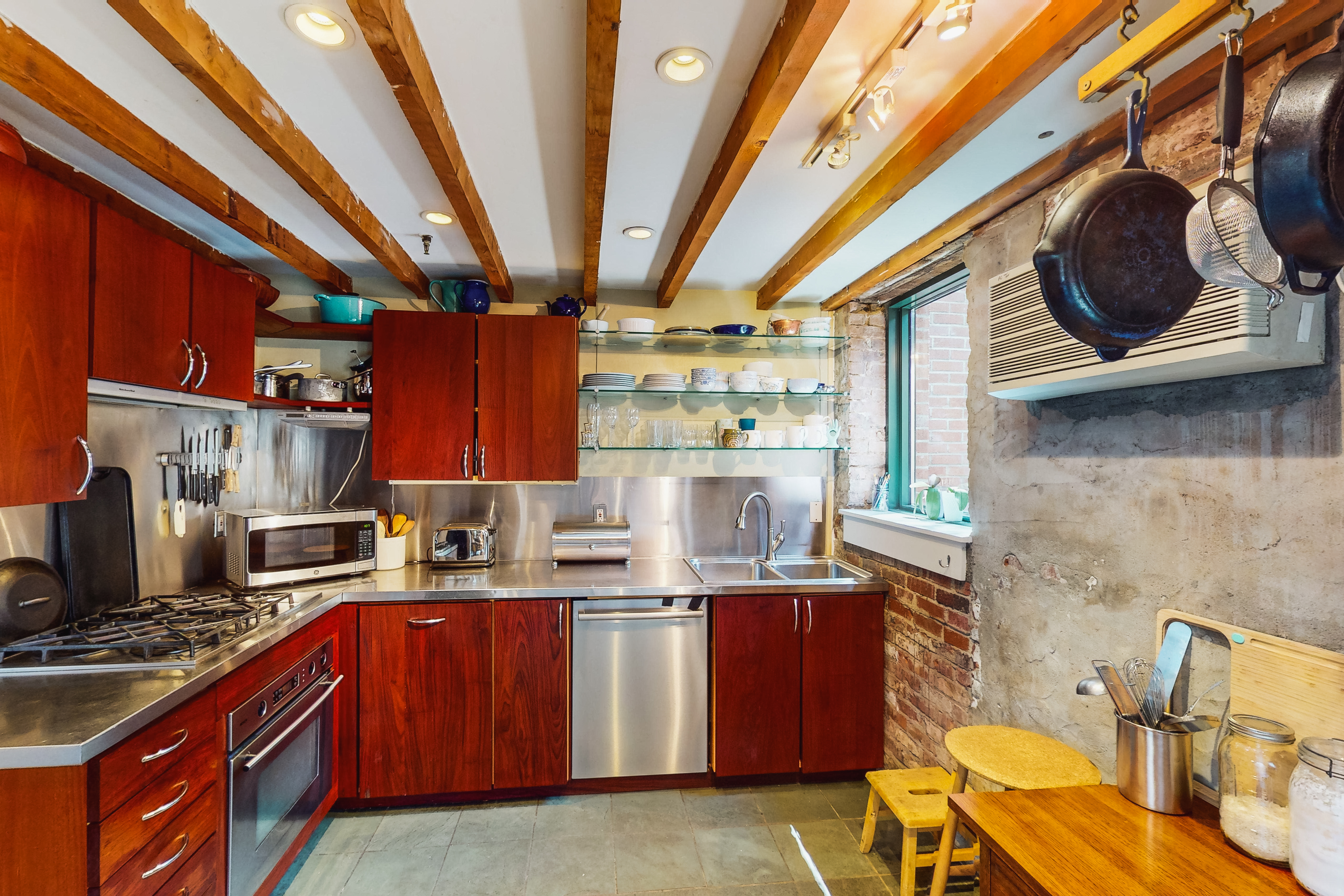 248 17th Street, Unit 6 Brooklyn, NY 11215 - Photo 6 of 21 a kitchen with stainless steel appliances granite countertop a sink a stove and a wooden floors