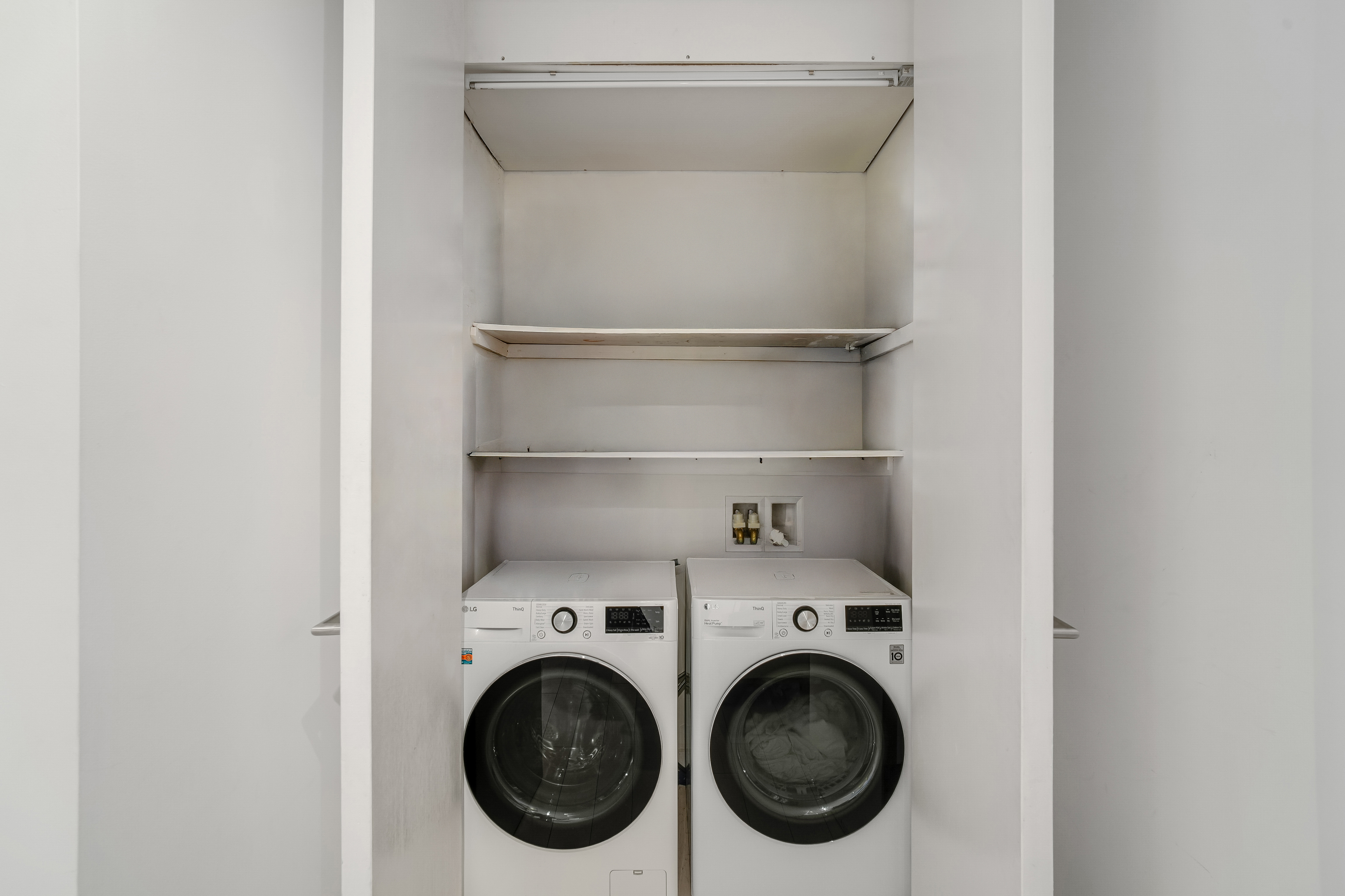 450 East 83rd Street, Unit 6B Manhattan, NY 10028 - Photo 21 of 25 a utility room with dryer and washer