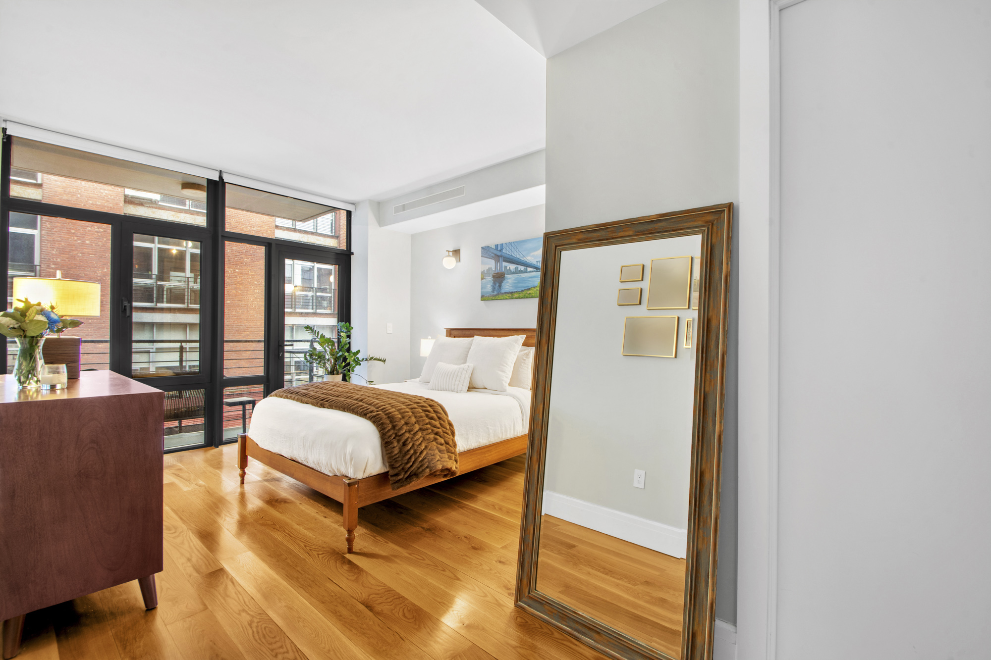 47 Bridge Street, Unit 3D Brooklyn, NY 11201 - Photo 10 of 27 a bedroom with a bed and wooden floor