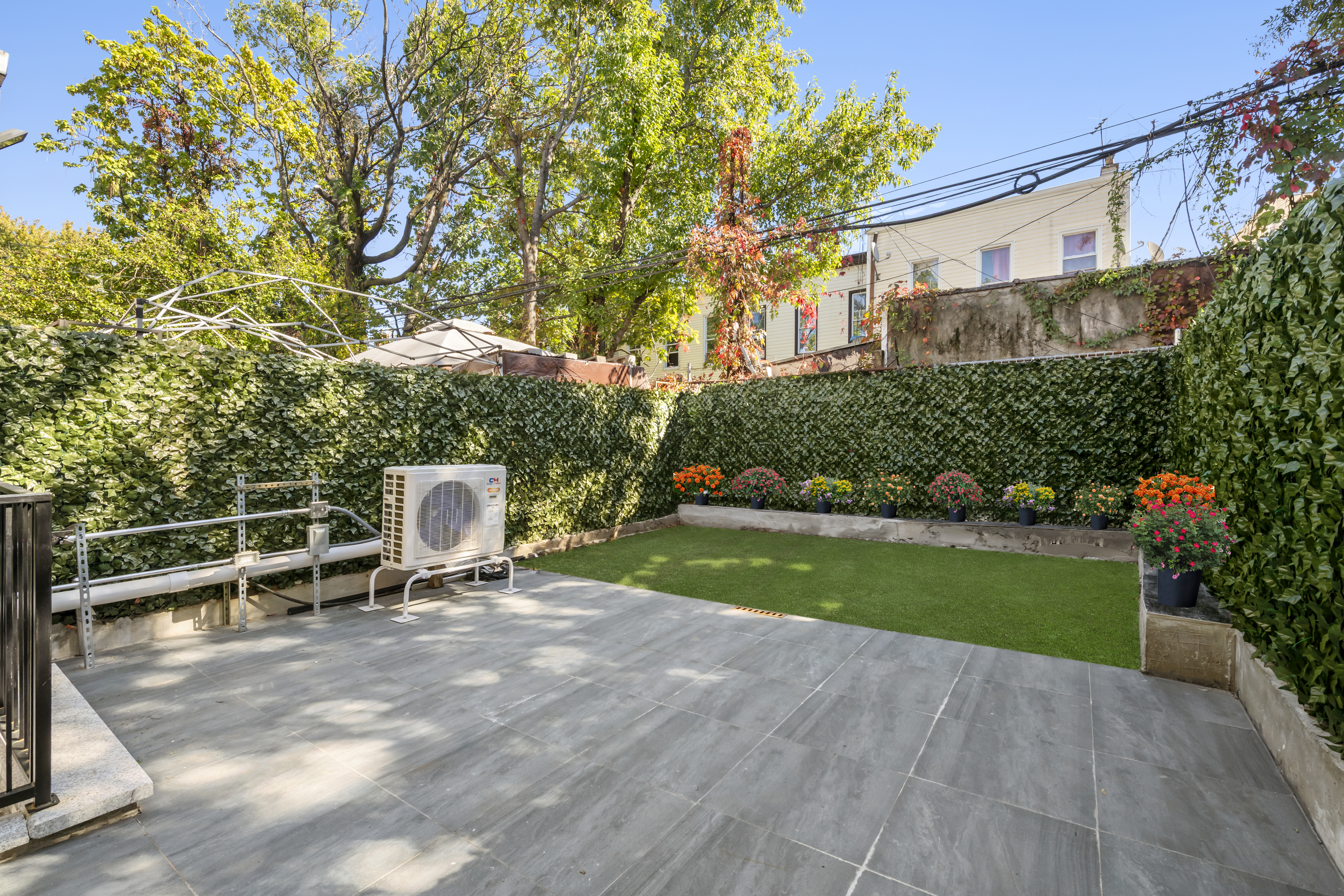 84 Himrod Street Brooklyn, NY 11221 - Photo 11 of 35 a view of a chair and table in the garden