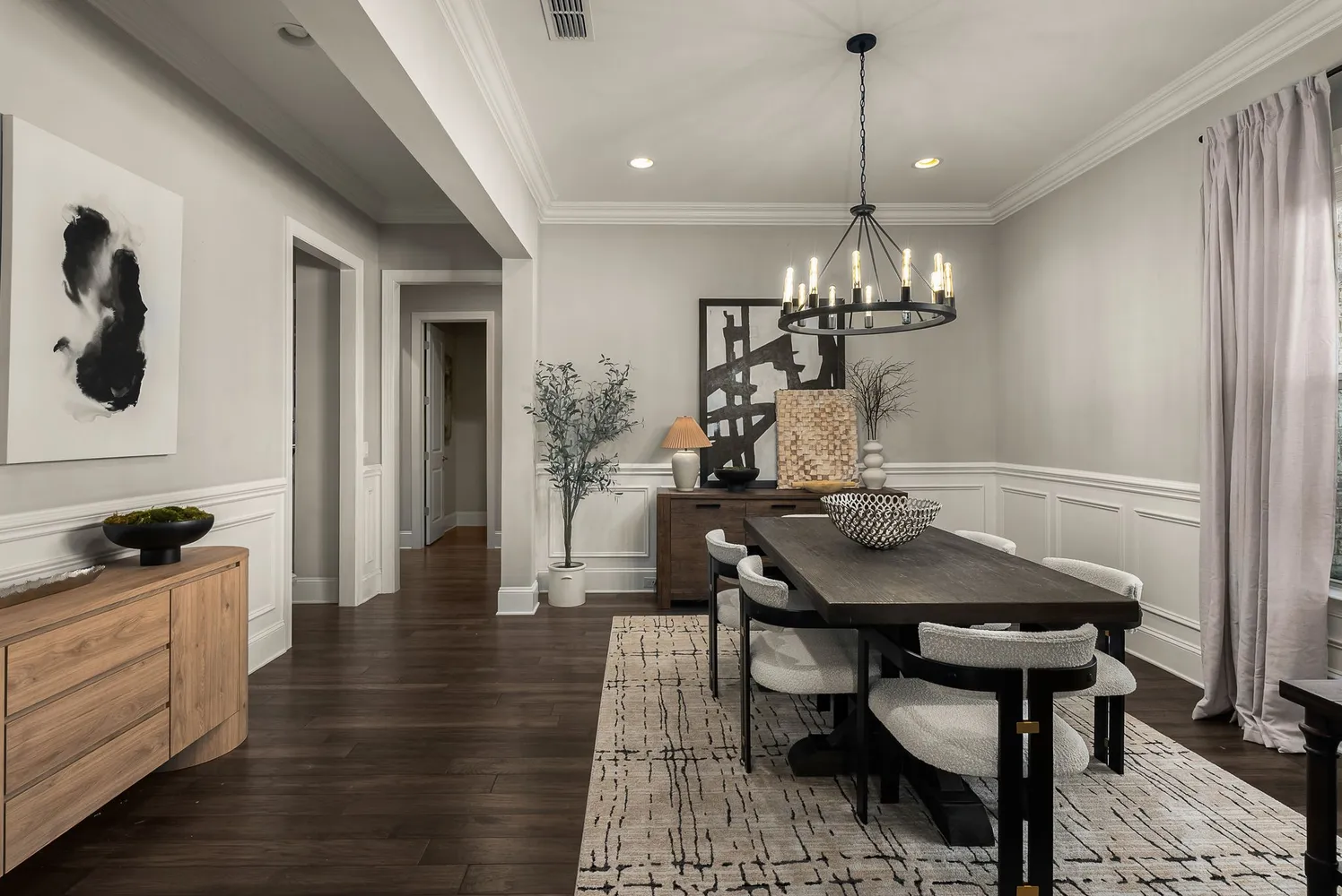 a view of living room with furniture and wooden floor