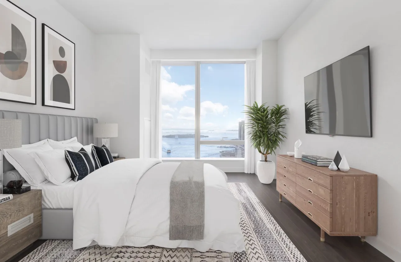 a spacious bedroom with a large bed and a large window