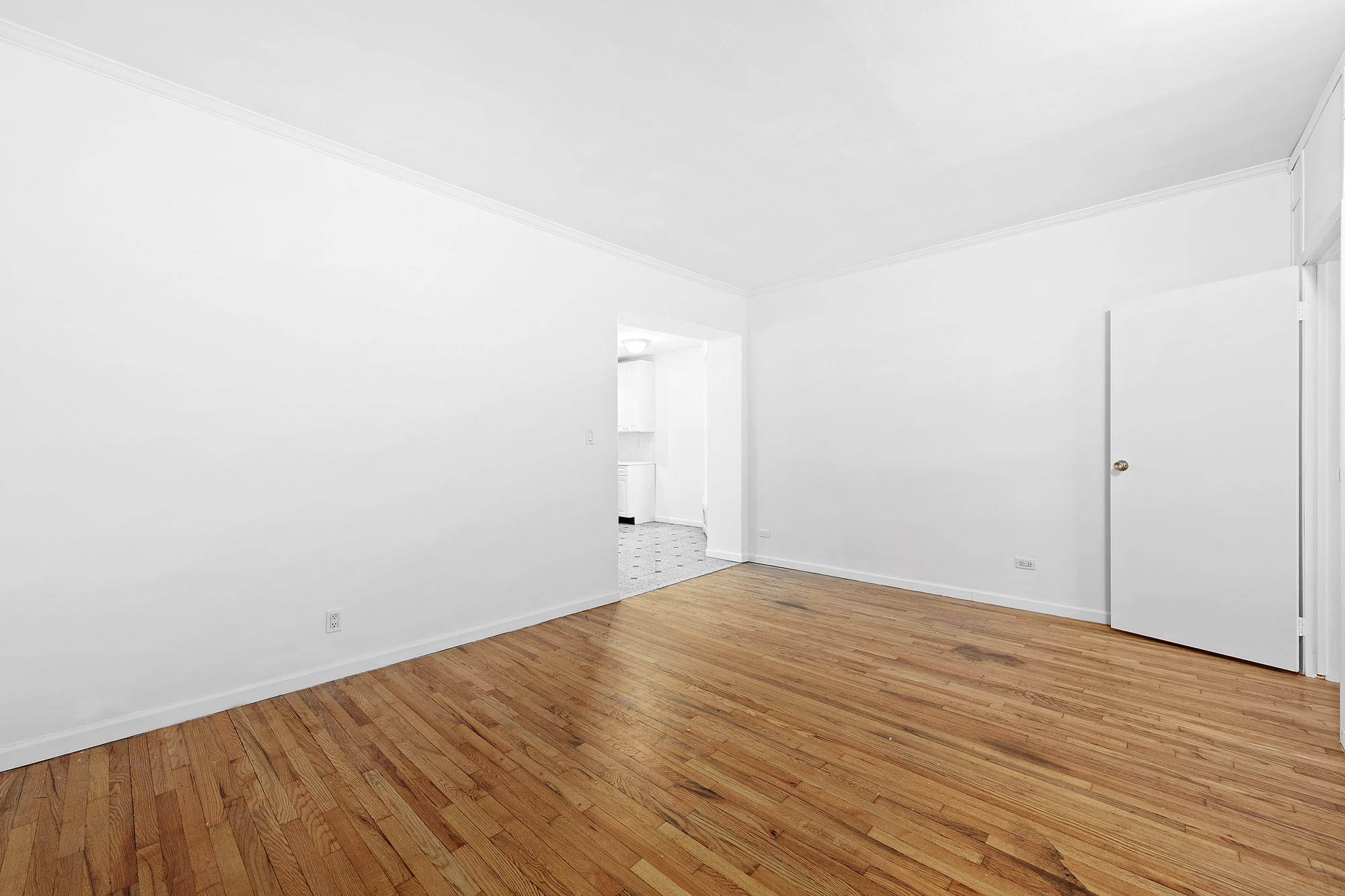 330 East 58th Street, Unit 5F Manhattan, NY 10022 - Photo 2 of 10 a view of an empty room with wooden floor