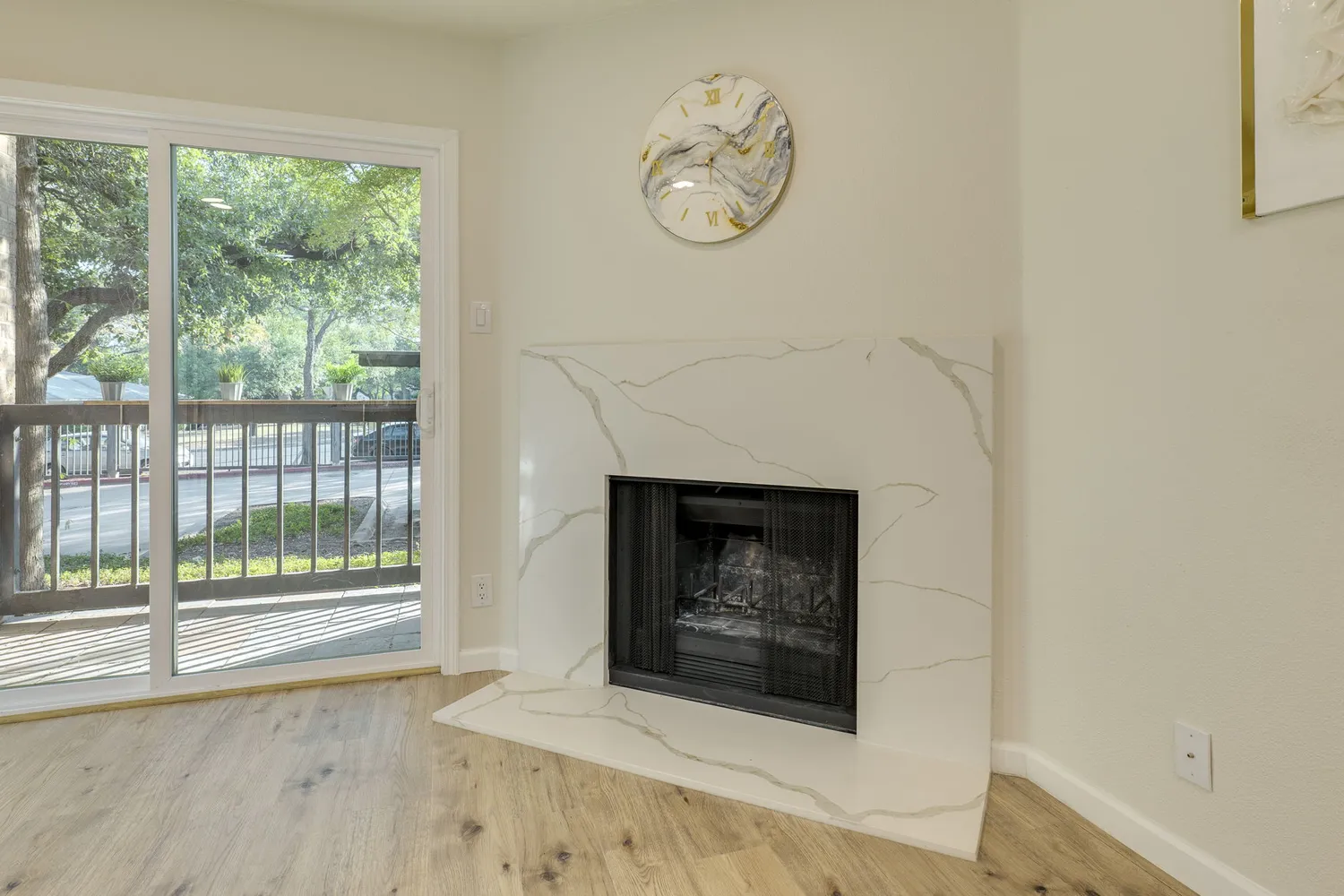 a living room with a fireplace and a window