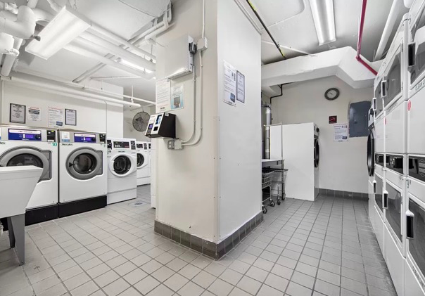 251 East 32nd Street, Unit 19F Manhattan, NY 10016 - Photo 9 of 13 a utility room with dryer and washer