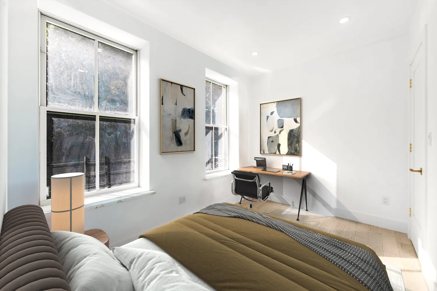 a bedroom with a bed and wooden floor